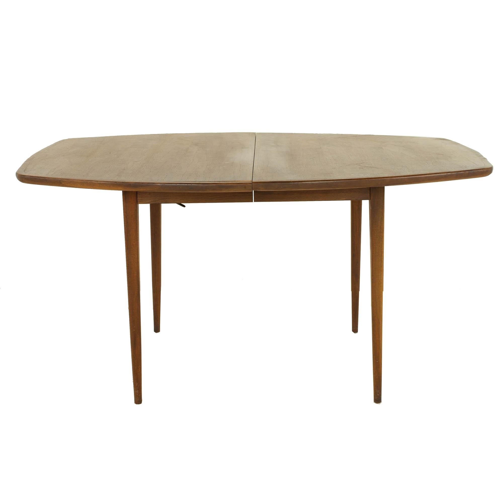 Dillingham mid century surfboard walnut dining table

This table measures: 58 wide x 40 deep x 30 inches high, with a chair clearance of 28.5 inches, each of the two leaves measure 18 inches wide, making a maximum table width of 94 inches

?All