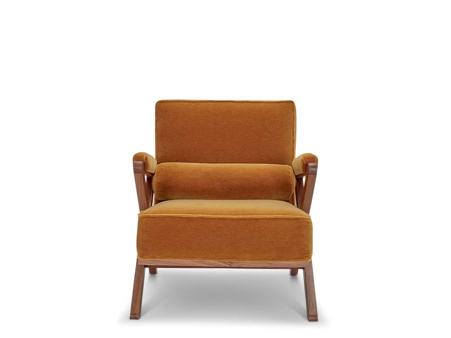 The Dillon chair has a solid American walnut or white oak x-based frame that features boxed cushions with piping and buttons on the back cushion. 

 The Lawson-Fenning Collection is designed and handmade in Los Angeles, California. Reach out to