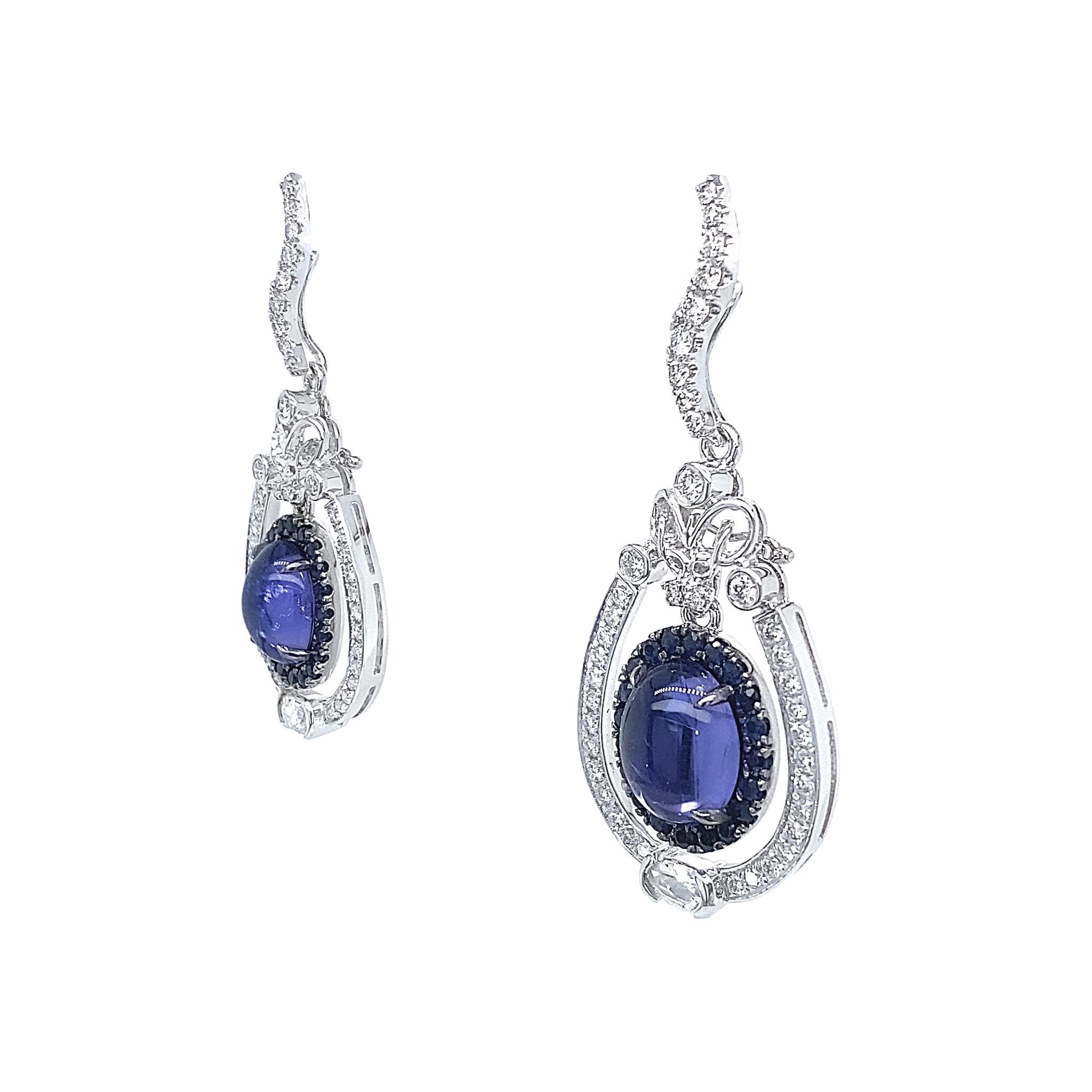 A pair of rare transparent 4.30ct Tanzanite cabochon drop earrings, certified by IGI to be 'Intense Bluish Violet'. Designed versatile to be worn in different ways, they are handcrafted in-house by expert artisans.

2 IGI Certified 'Intense Bluish