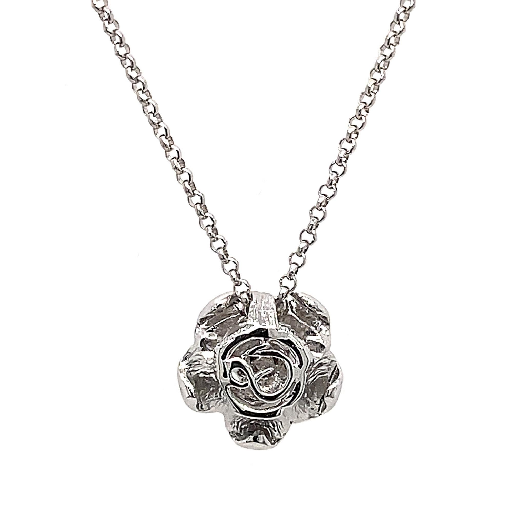 A blooming rose ­- the universal symbol for love, beauty and gratitude. 

Dilys' Blooming Rose Solitaire Diamond Necklace features the rose motif with a round collection-grade solitaire diamond as the centrestone (0.07ct). Set in 18K white gold,
