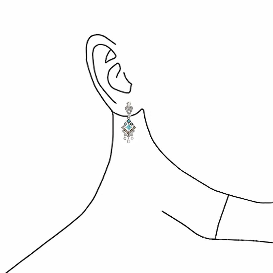 As part of Dilys’ Novel Collection, the design of these stunning 'Barocca' earrings is influenced by the Portuguese colonial architecture in the birth place of Paraiba Tourmalines, Brazil. The 8 lively centre stones are paired with 18 contrasting
