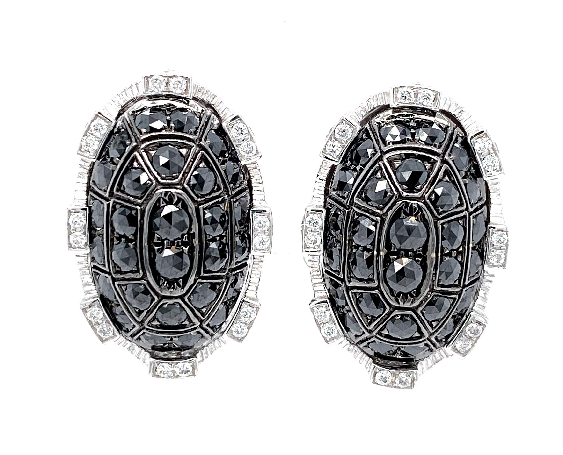This bold and edgy pair of statement stud earrings by Dilys’ was inspired by castle fort walls and designed to represent strength and integrity. The dome motifs in the middle are set with a total of 56 black diamonds totaling 1.72 carats, while the