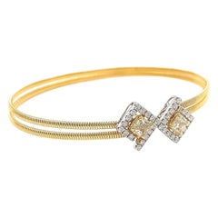 Brazalete de titanio y oro amarillo de 18 quilates con diamantes de Dilys