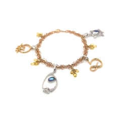 Pulsera de oro de 18 quilates con dijes italianos de verano de Dilys con piedras de luna y diamantes