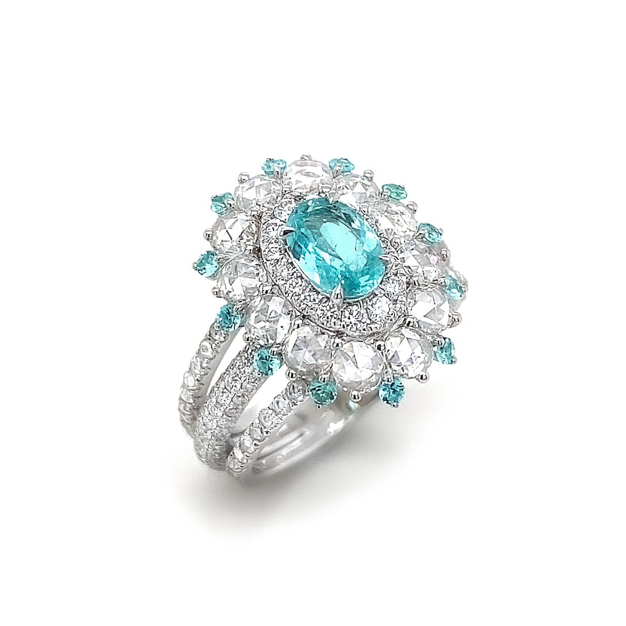 The prized Brazilian Paraiba ring set in an exquisite, timeless design by Dilys' – the well-known connoisseur of coloured gems – in 18K White Gold.

1 ICA Certified Brazilian Paraiba, totalling 0.49ct 
12 Round Brazilian Paraiba, totalling 0.15ct
12