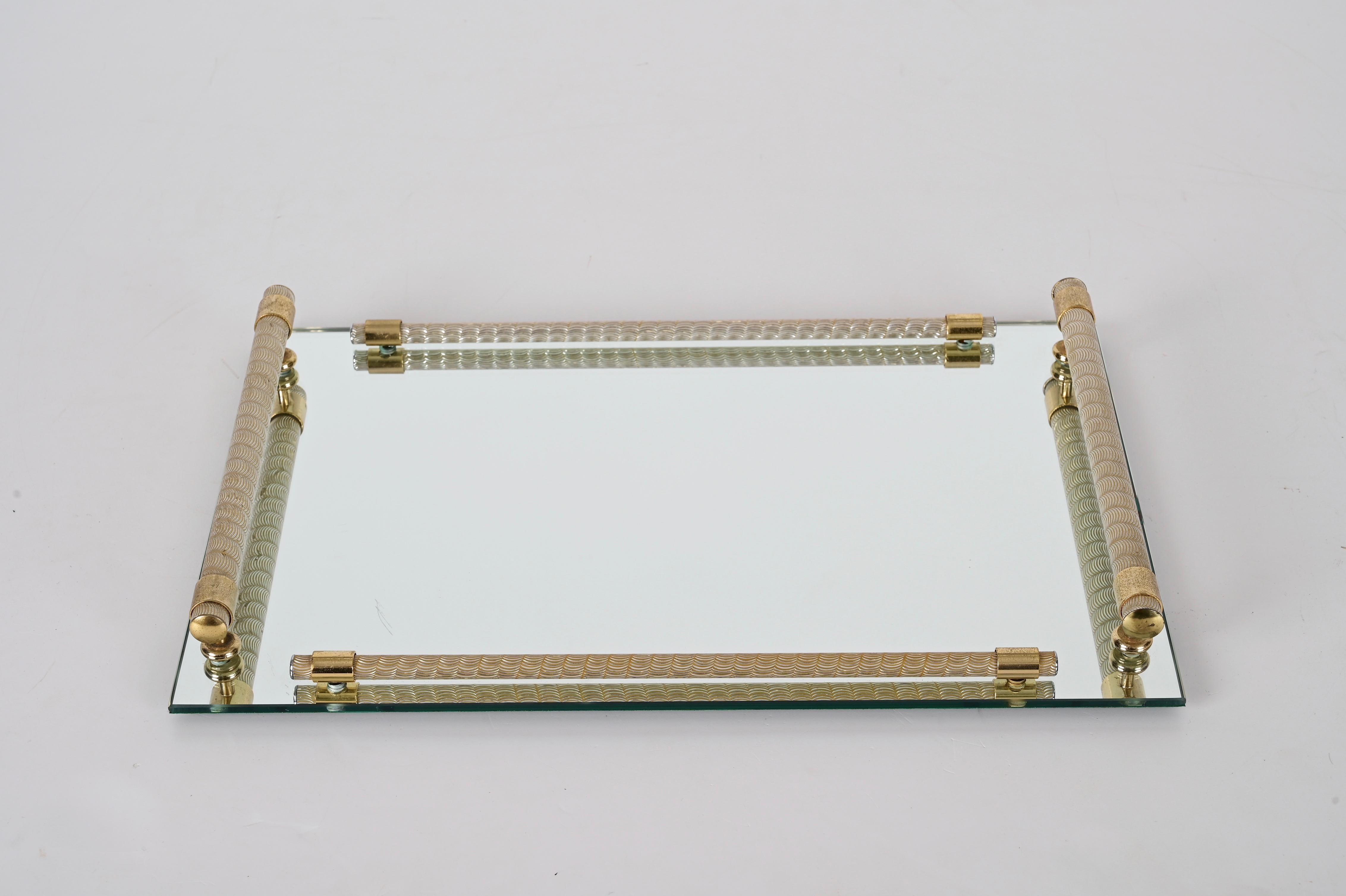 Amazing midcentury 24K gold plated tray with mirror and brass. Dimart Milano produced this item in Italy during the 1980s.

This simple and elegant tray is unique in its 24k gold plated brass complementing the finely finished rim and refined