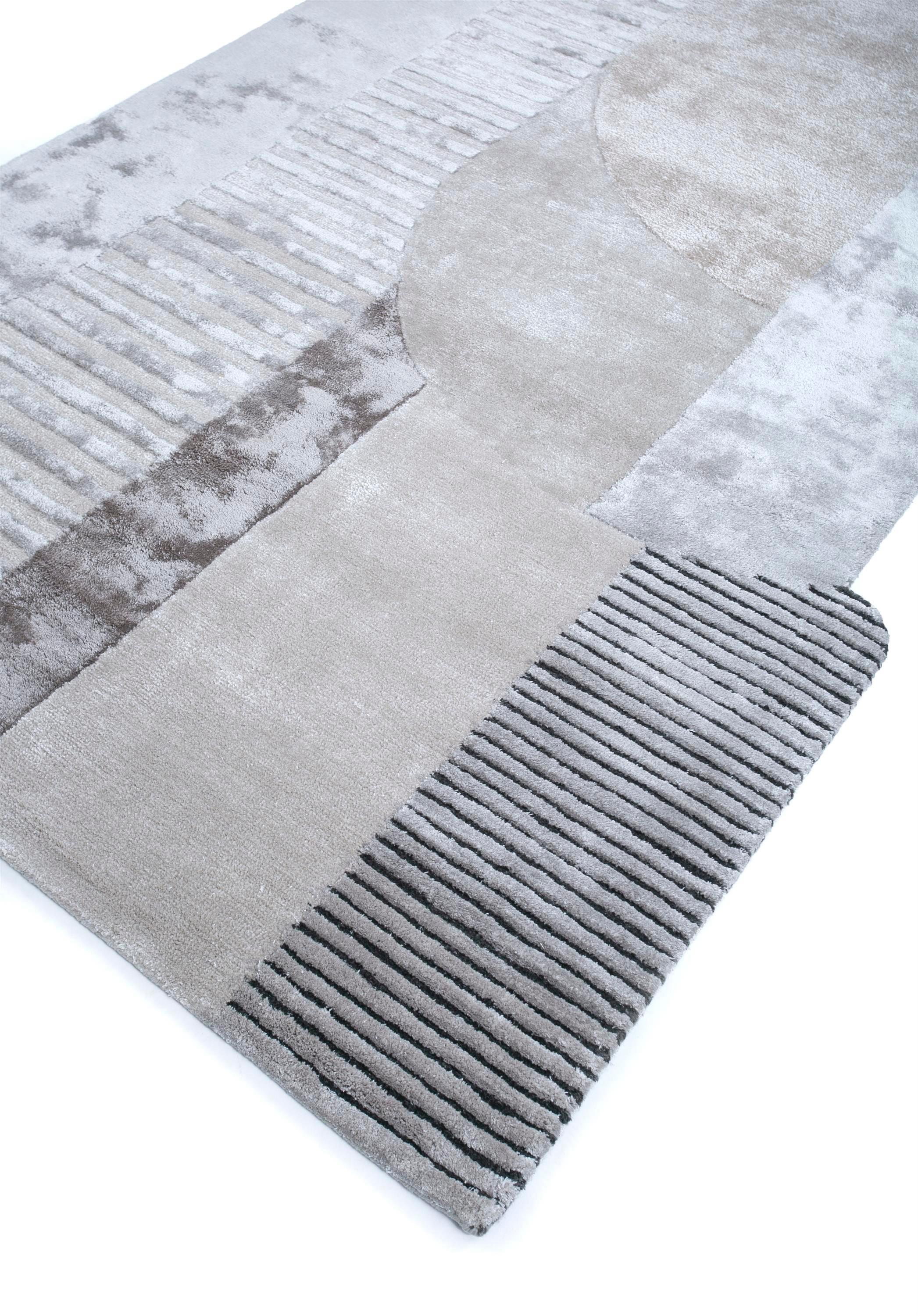 Ever wondered how art could seamlessly blend with functionality? Behold this modern hand-tufted rug, a captivating masterpiece handmade in rural India. This bold creation is a playful fusion of soft geometry and joyful colors, meticulously crafted