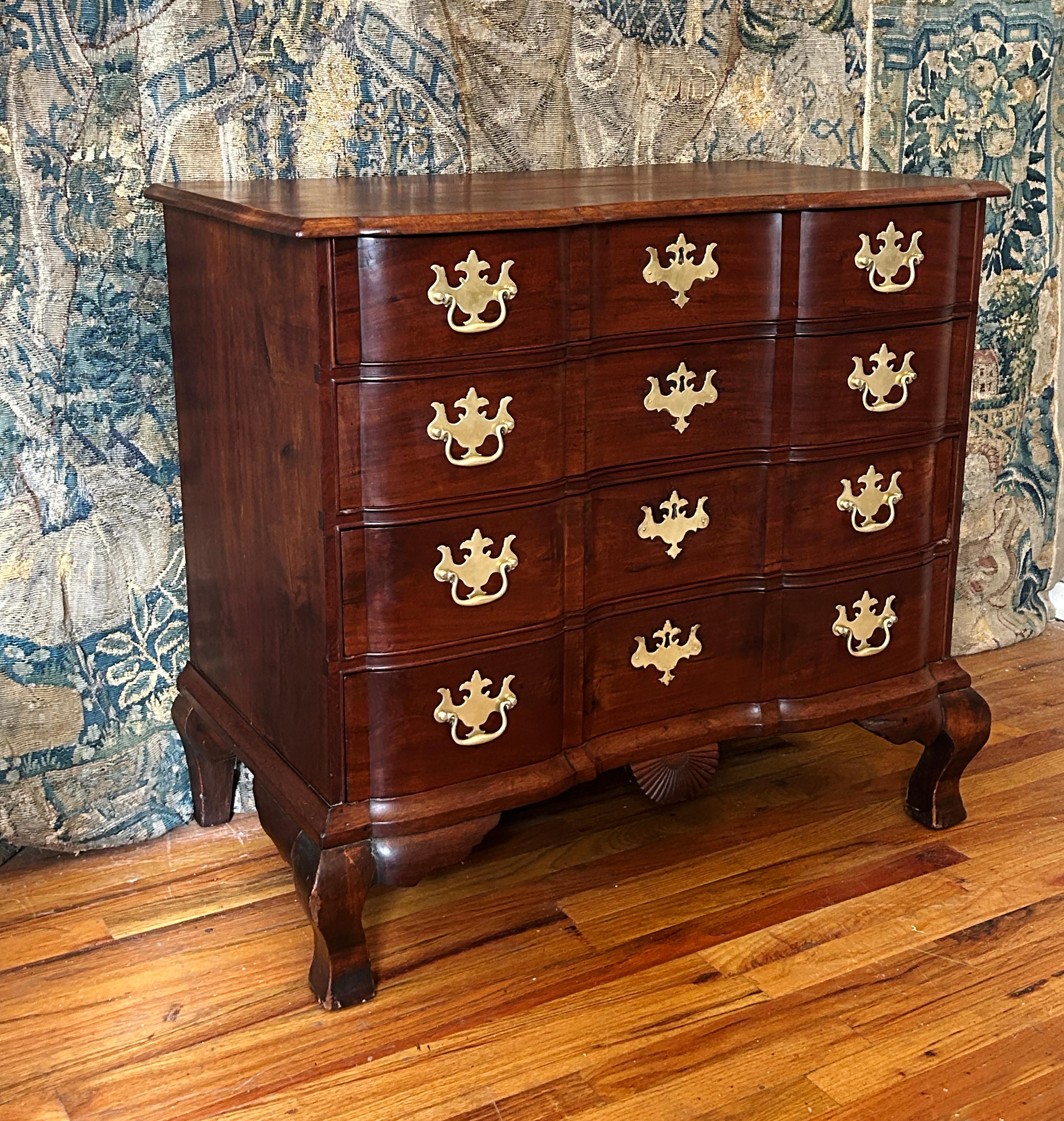 A diminutive block-front colonial American chest from the third quarter of the 18th century.  Lovely mahogany timber and patina, the chest exhibits a number of characteristics of the workshop of George Bright (1726-1805).  Four graduated drawers sit