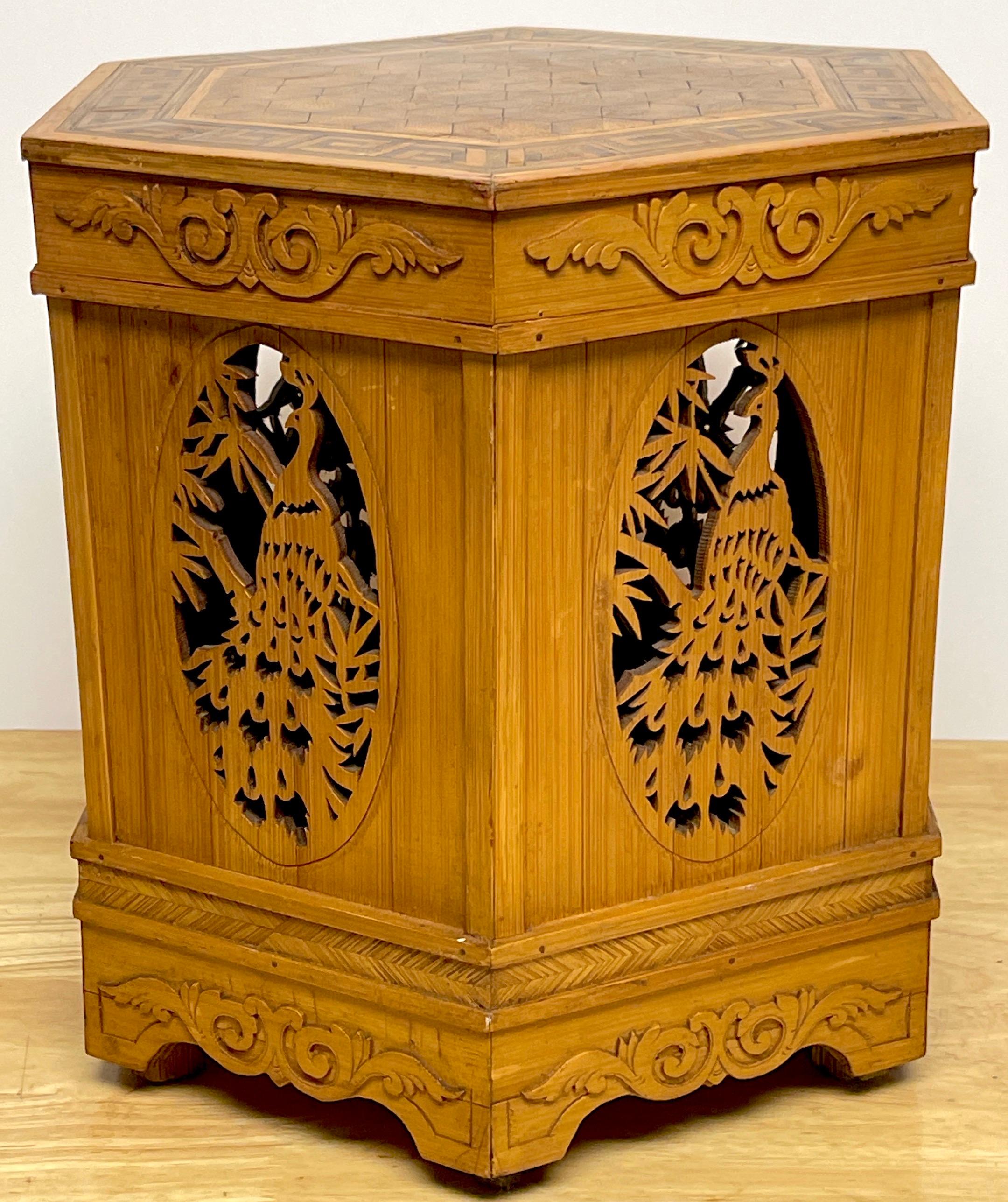 Diminutive American Aesthetic Movement peacock Motif pedestal of side table
of hexagonal form with a stylized Greek key border, with penwork decorated cube-work center. Supported on a conforming base with a 6-inch high x inch wide carved/pierced