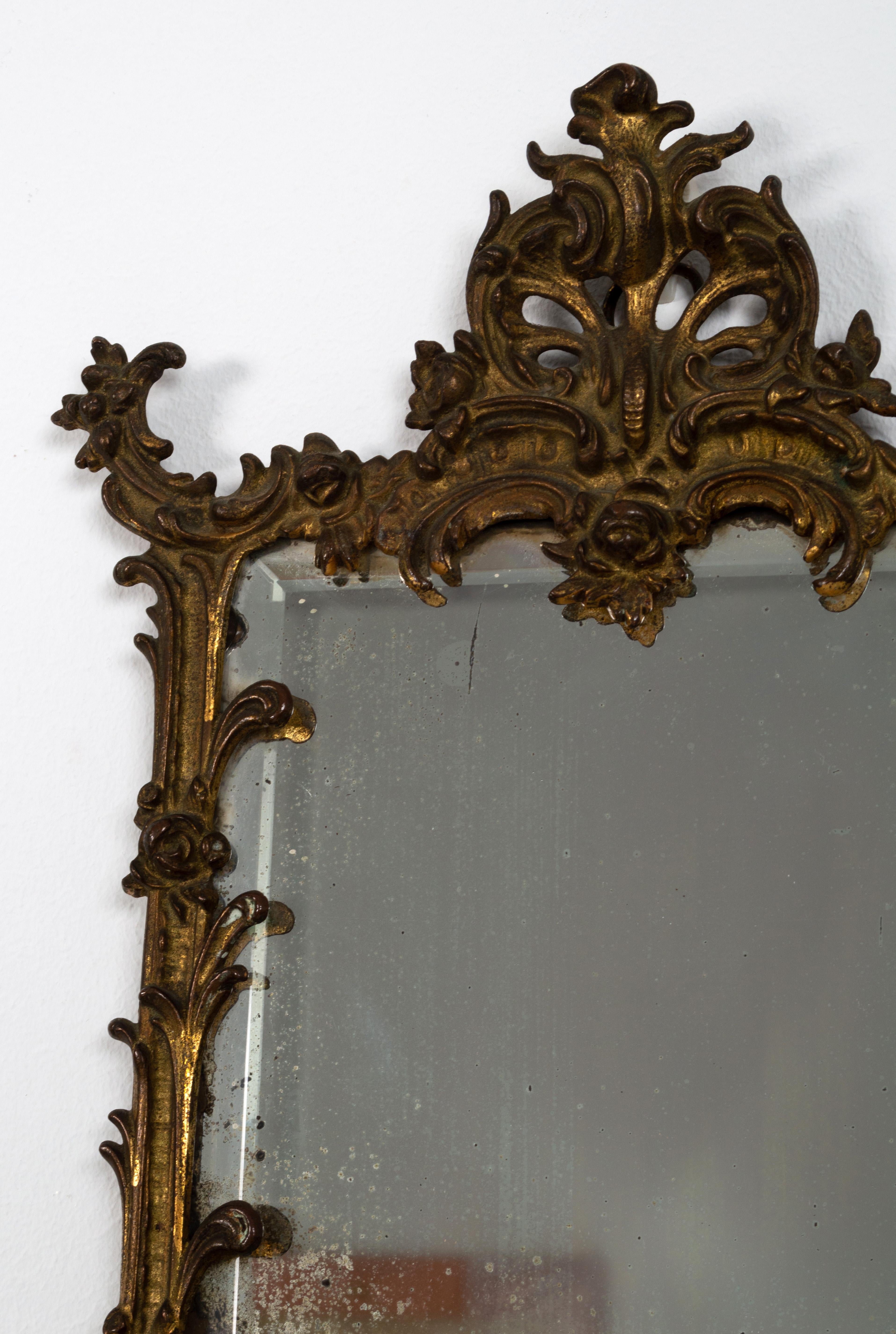 Diminutive Antique French 19th century Gilt Mirror.

Of small proportions, the bevelled plate framed by scrolling foliate decoration. Original mercury mirror.

A handsome example.