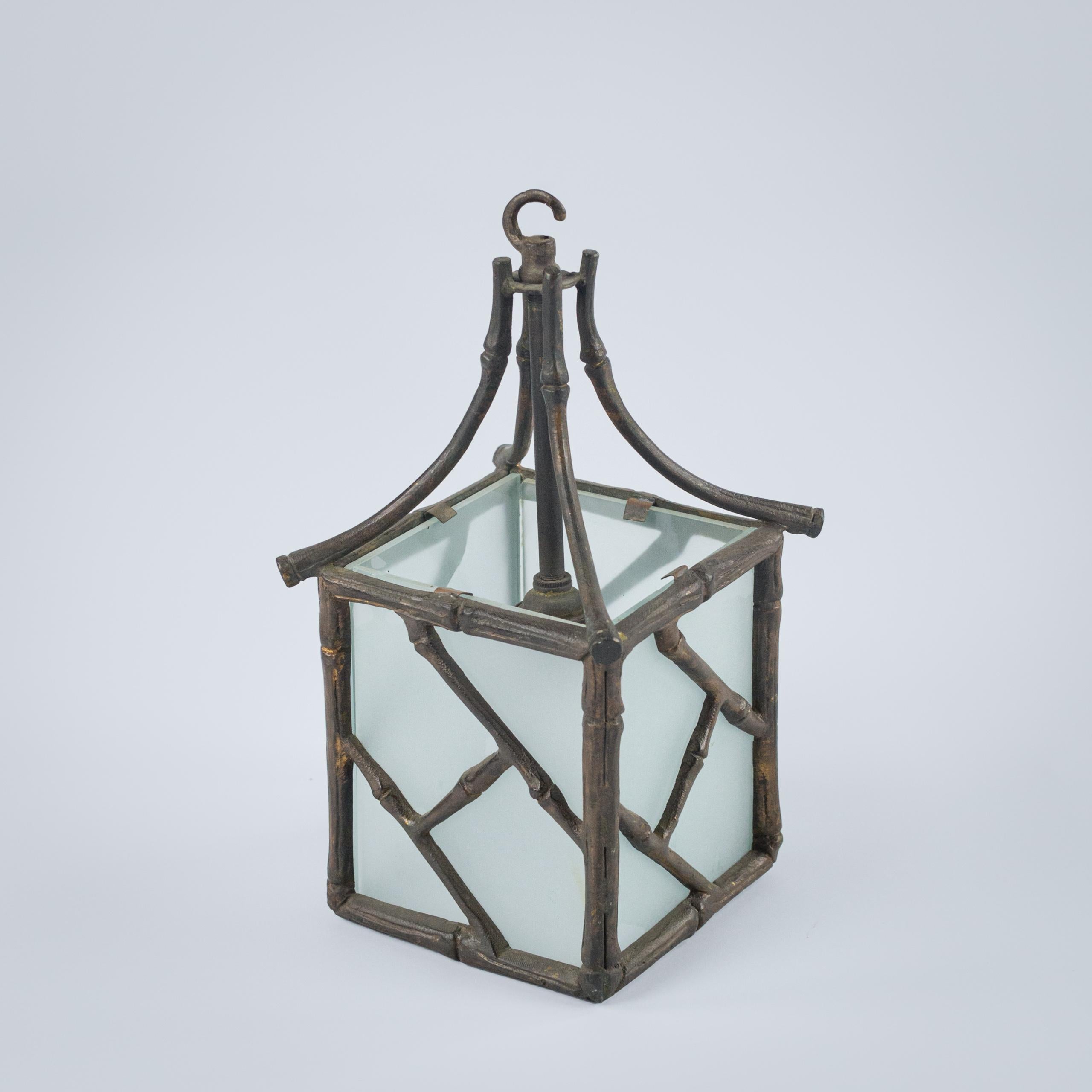 Exquisite small bronze lantern likely by Maison Bagues features a delicate faux bamboo pattern in pagoda shape showcasing the brand's signature craftsmanship. Its rich patina enhancing the aged bronze adding to depth and character. The lantern