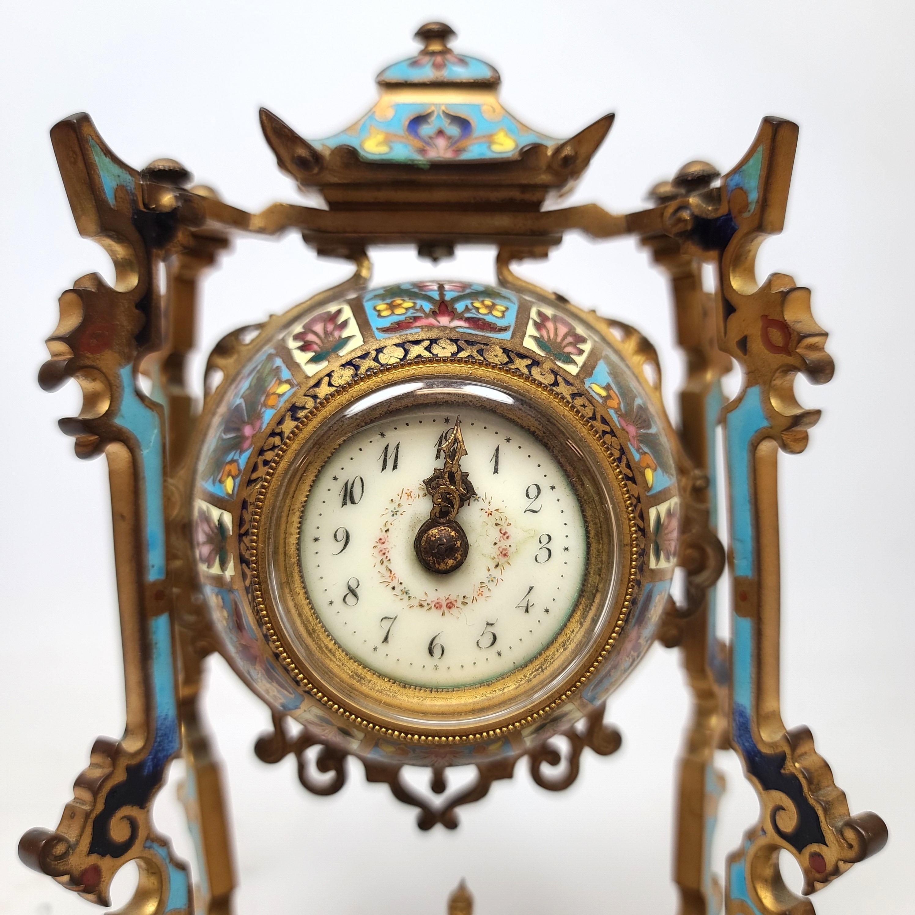 French 19th century diminutive chinoiserie champlevé clock set with a seated Buddha figure in the middle.
 