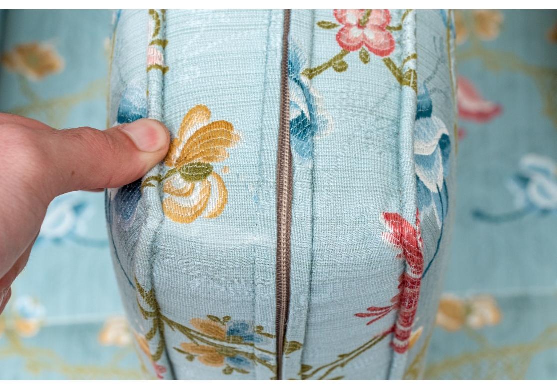 A fine Club Chair with T form seat cushion, shaped back, flat panel arms and good traditional form.  Custom upholstered in a bright and colorful floral fabric having a Sky Blue background with Pink, Olive and Blue flowers. 

Dimensions: 28.5” wide