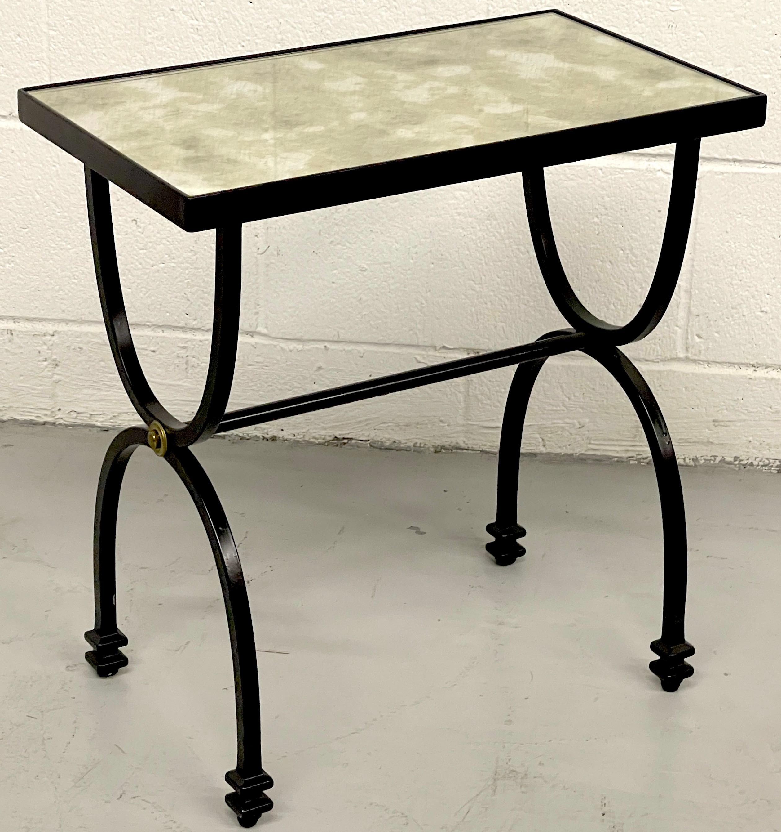 Diminutive French Modern Style side table, Style of Maison Jansen 
France, Late 20th C
Of rectangular form, with inset distressed mirror (removable) supported on a blackened iron and brass mounted curule stretcher base. 
Overall