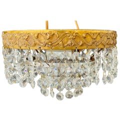 Diminutive French Regency Style Crystal and Brass Chandelier
