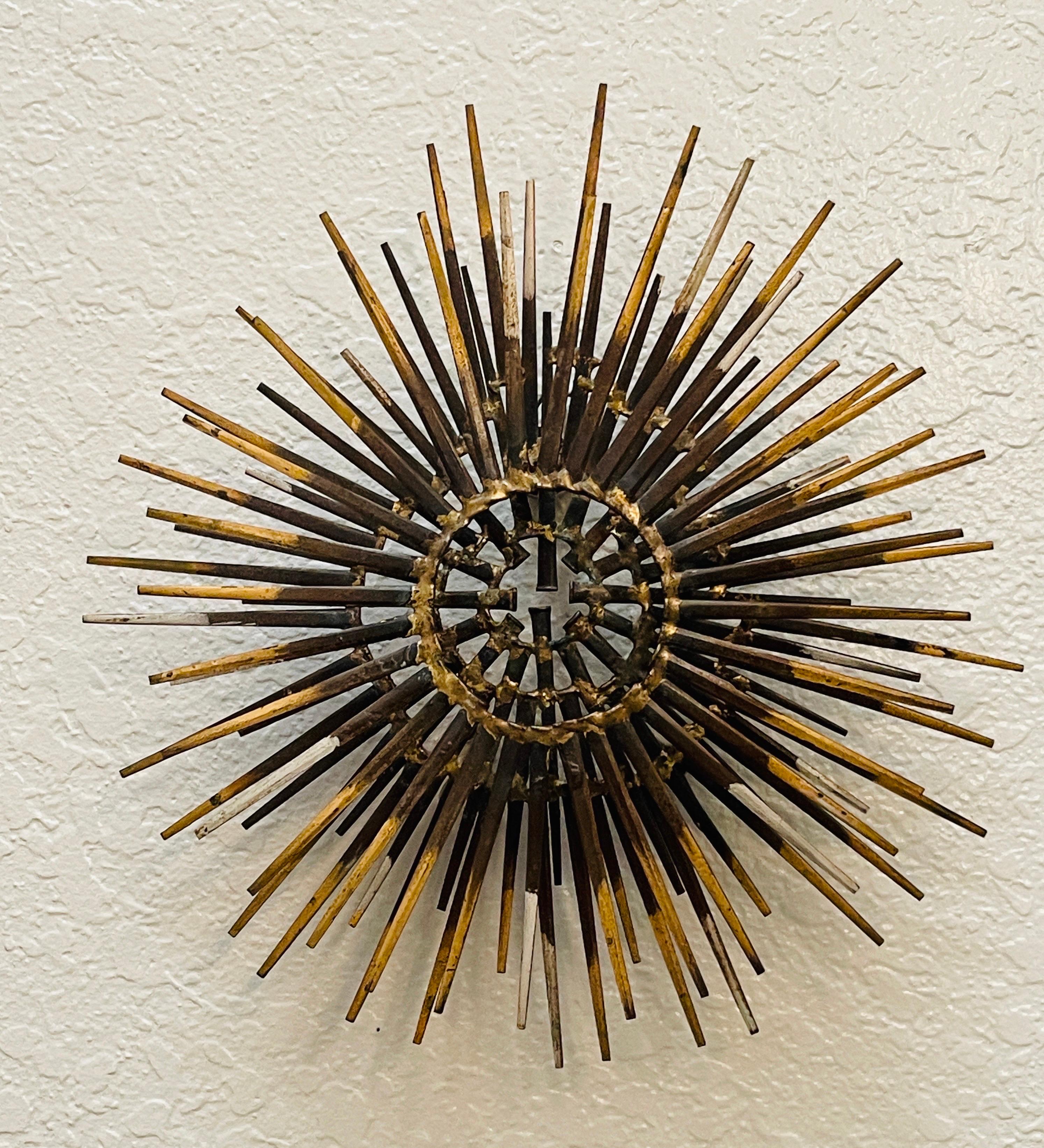 Diminutive Gilt Iron Two-Tier Sunburst Wall Sculpture by William Bowie
USA, Circa 1970s, Unmarked.

A fine example of William Bowie's precisionly made two tier starburst wall sculpture. Ready to hang or place

Overall measurements
top tier has 11