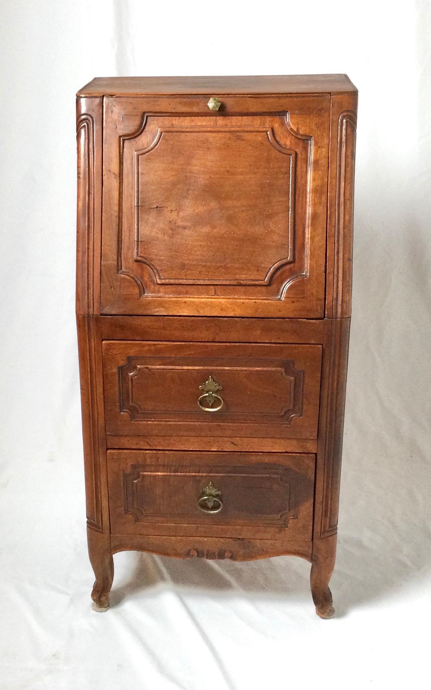 Diminutive Italian two-drawer drop front cabinet. Measures: 29