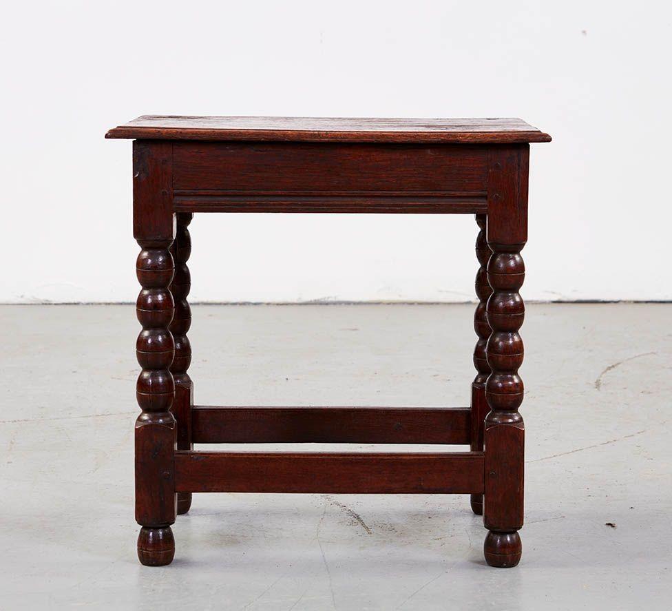 Fine James II period oak child's table, the single plank thumb molded top over channel molded aprons joining boldly bobbin turned legs joined by box stretchers and standing on original turned feet, the whole possessing good rich color and