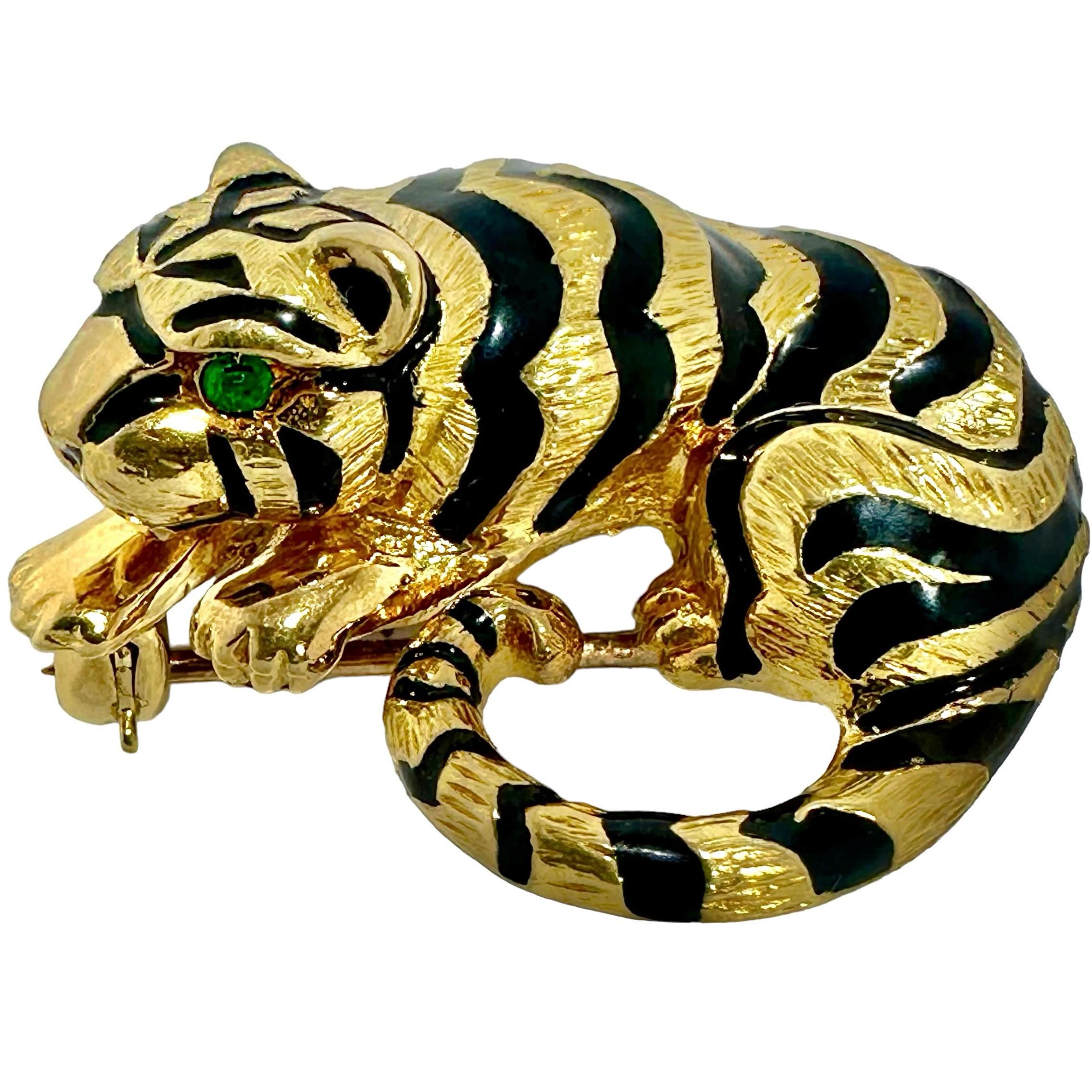 This petite but very bold and dramatic 18k yellow gold tiger brooch appears at rest, but ready to pounce. With a length of 1 3/16 inches, width of 1 inch and height of 1/2 inch, this very dimensional brooch is certain to make a lasting impression.