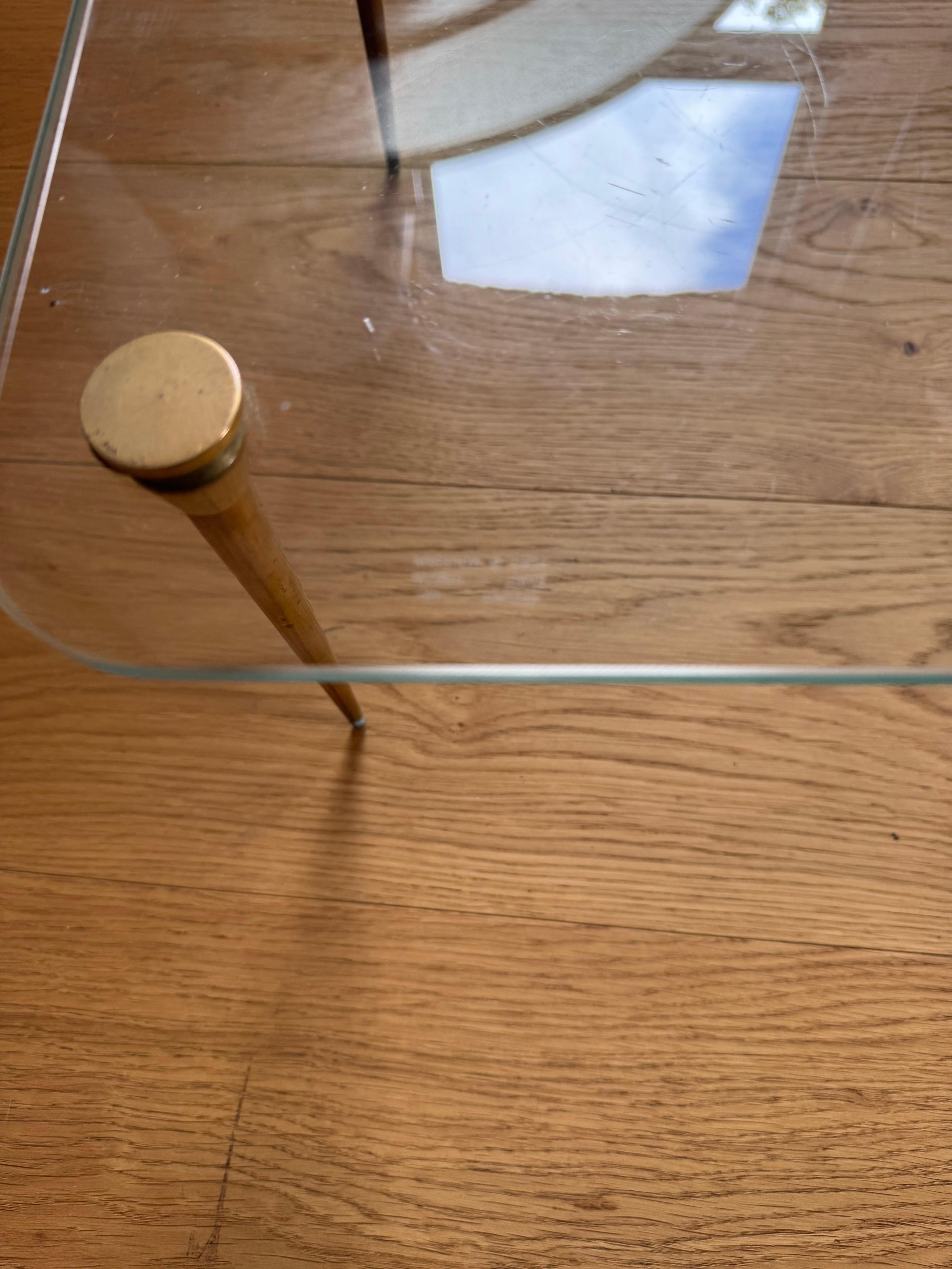 French Elegant and Diminutive Low Saint Gobain glass and gilt metal table c.1950's For Sale