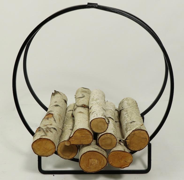 Architectural mid century log holder, circular form composed of wrought Iron. Nice usable scale, good clean ready to use condition.