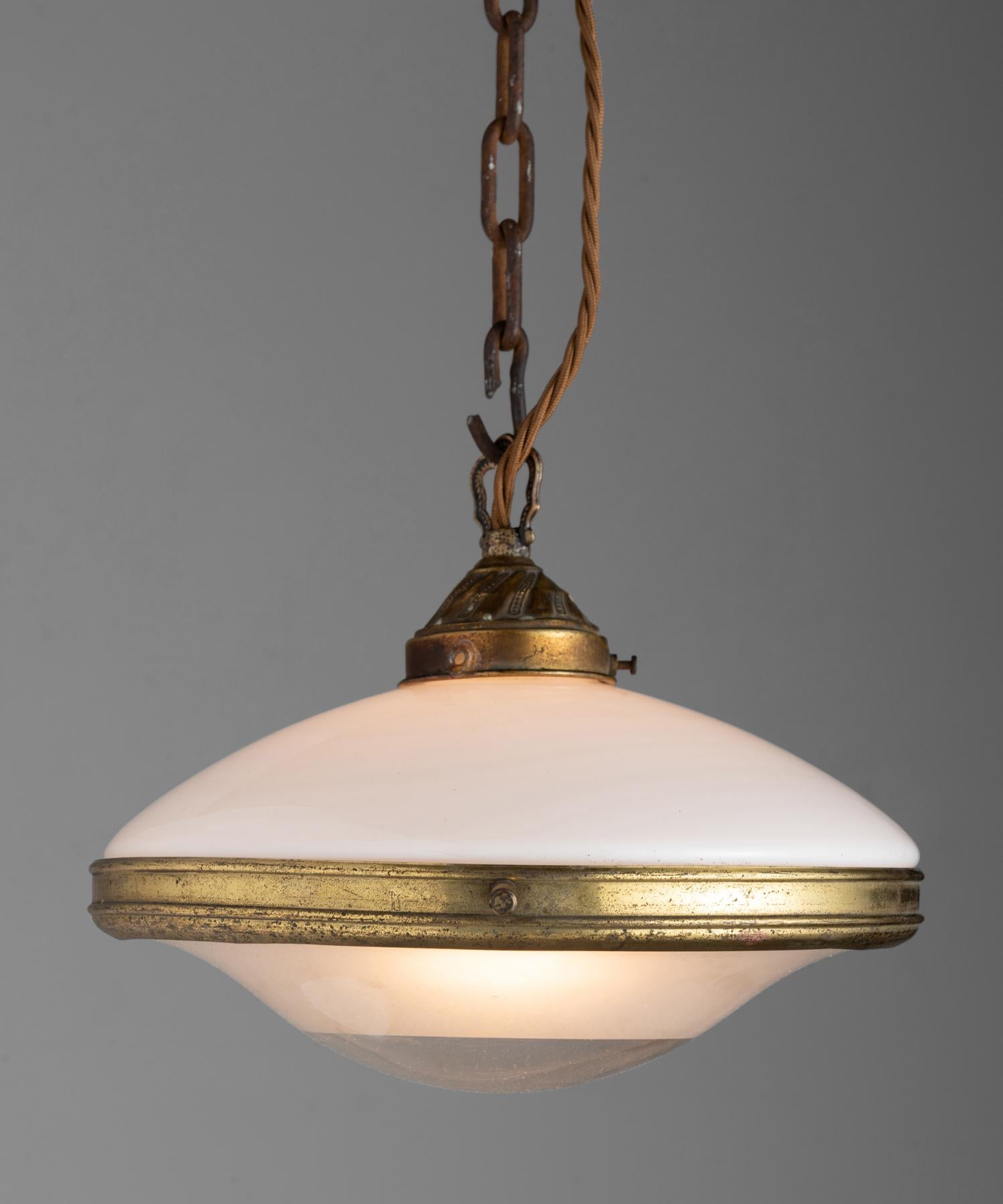 Petite opaline glass pendant with brass hardware.



Measures: 10.75” diameter x 7.75” height.
  