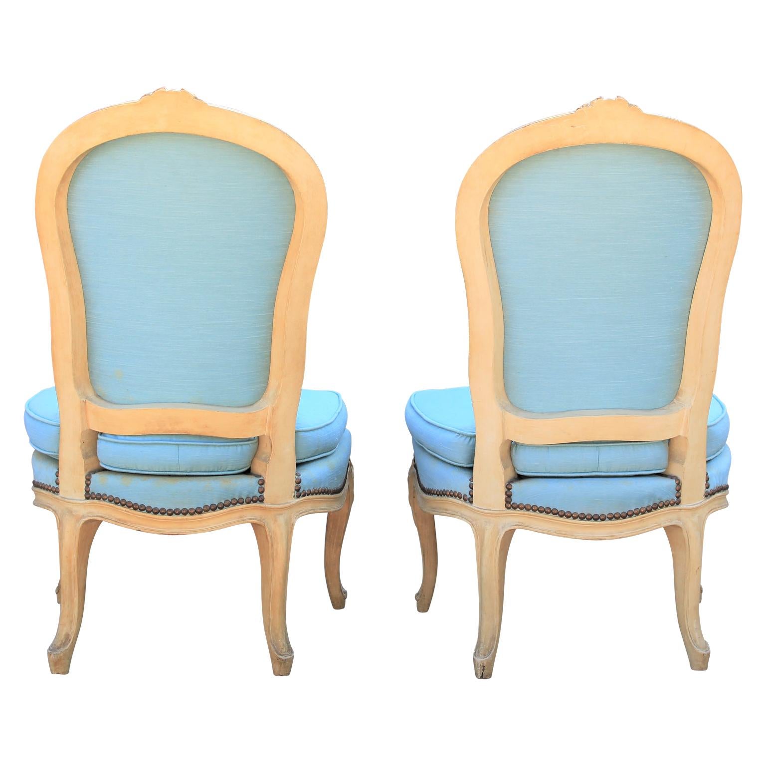 Diminutive pair of French carved painted wood slipper chairs. Perfect scale for a small space or occasional chairs. Currently in original usable fabric, however for perfection COM suggested. Custom finishing available.