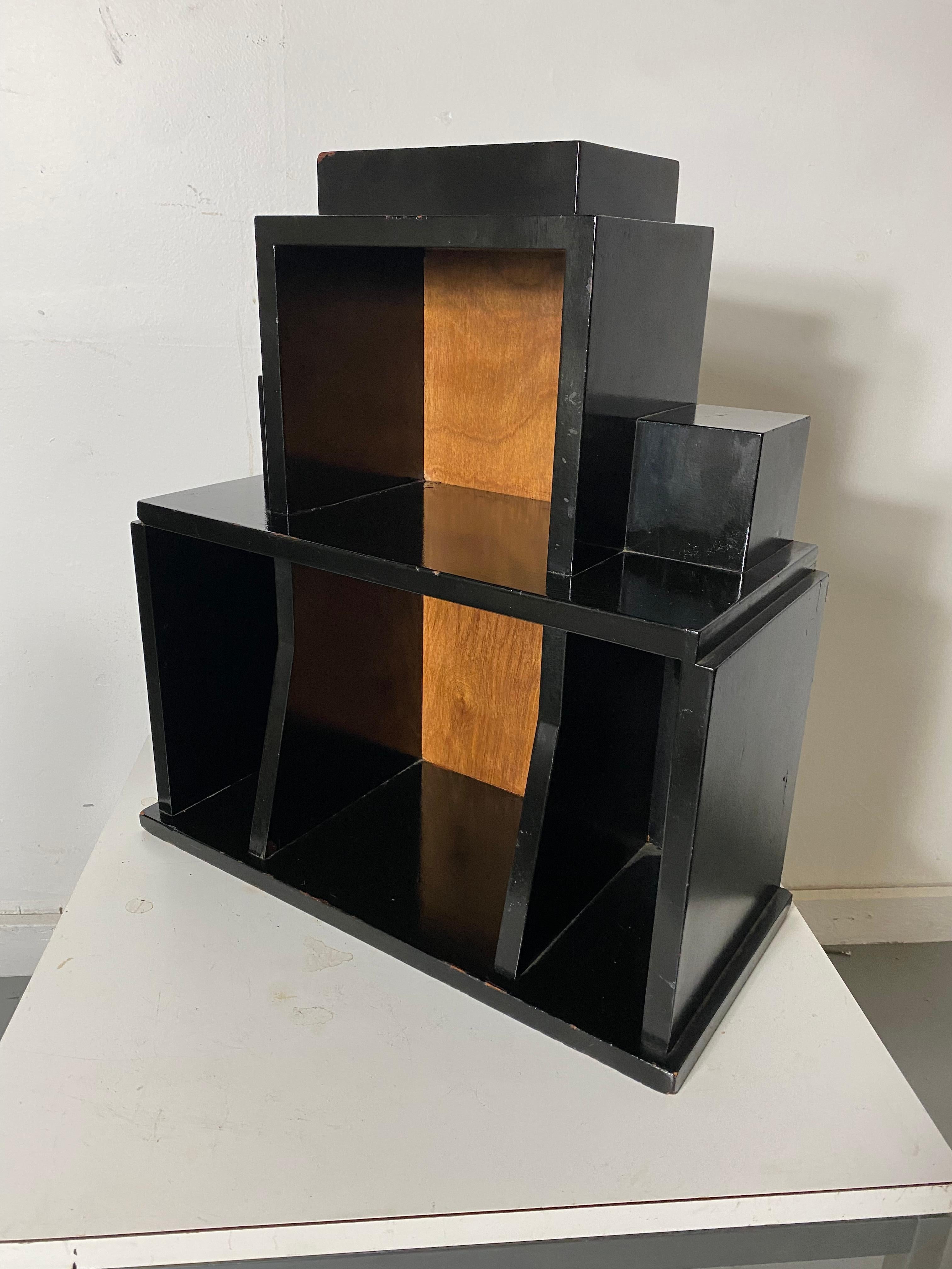 Extremely rare stand, table model 2188, designed by Paul Frankl, Skyscraper Furniture, c 1928. when sold, only avail at Frankl Galleries, New York City. Retains original metal SKYSCRAPER label / tag. Black lacquer and wood finish, Museum quality.