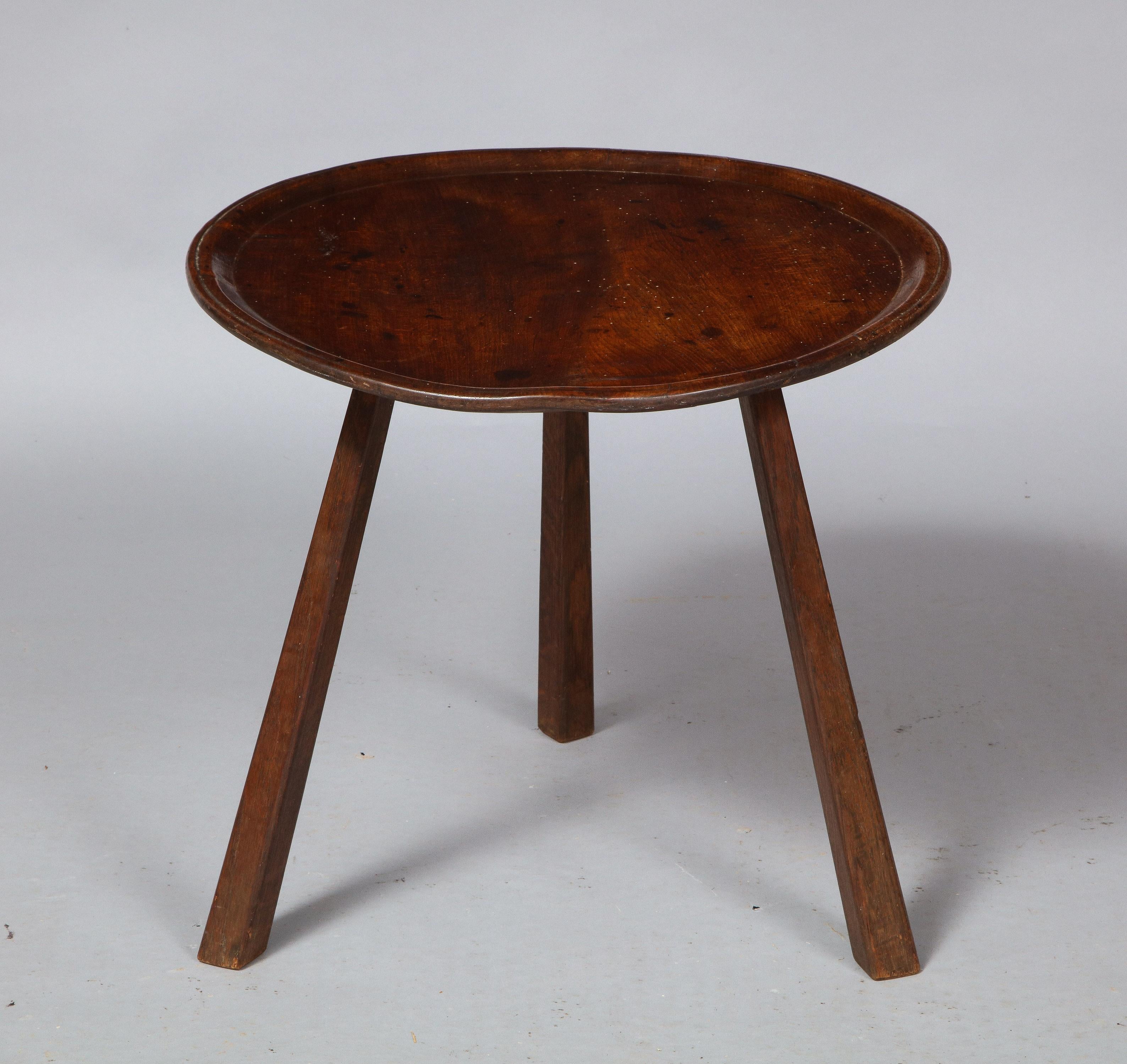 Charming and diminutive Welsh cricket table, the lathe turned top fashioned from a single plank of sycamore over three splayed spoke shaved legs, the whole with good rich color.

 