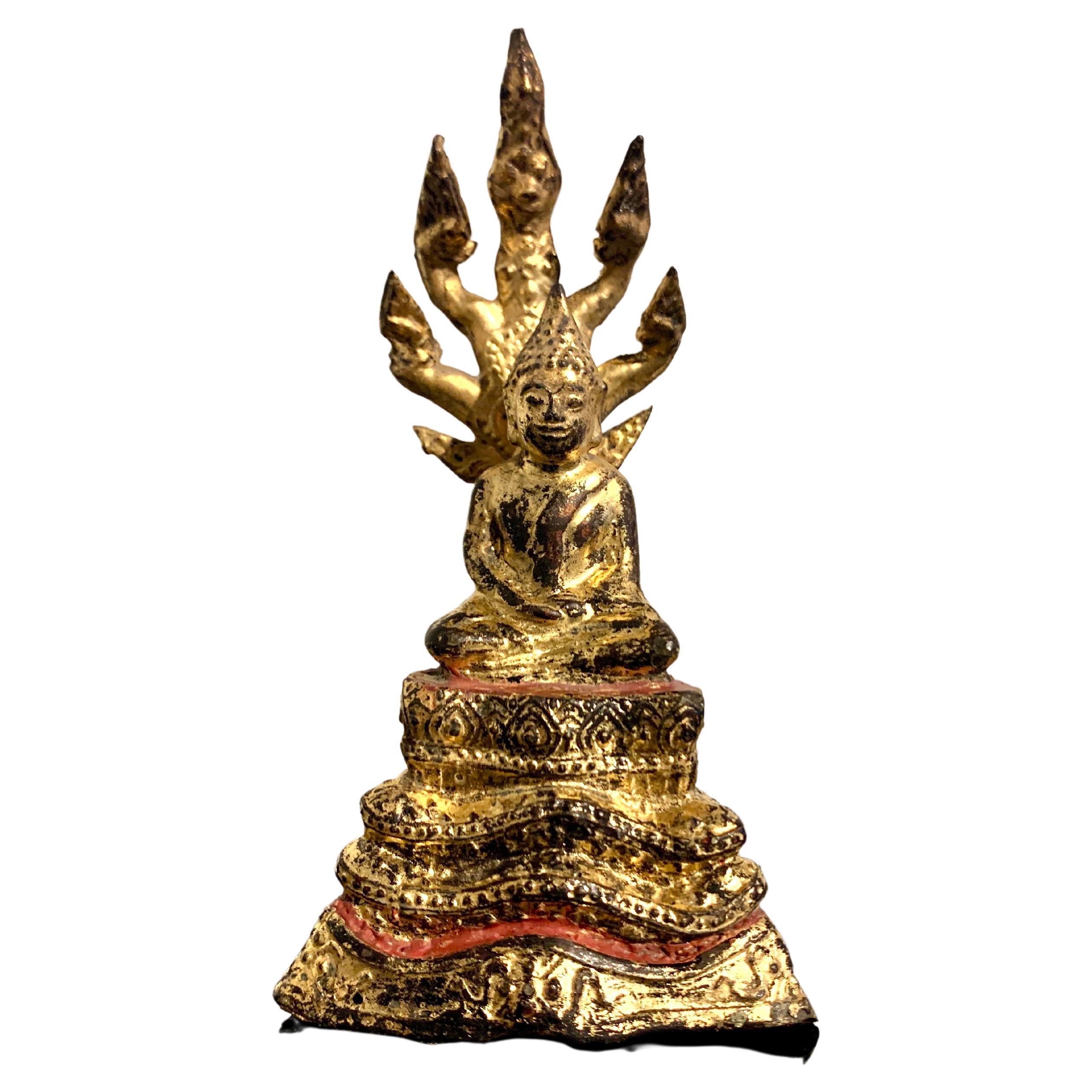 Diminutive Thai Rattanakosin Gilt Bronze Buddha and Naga, 19th Century, Thailand