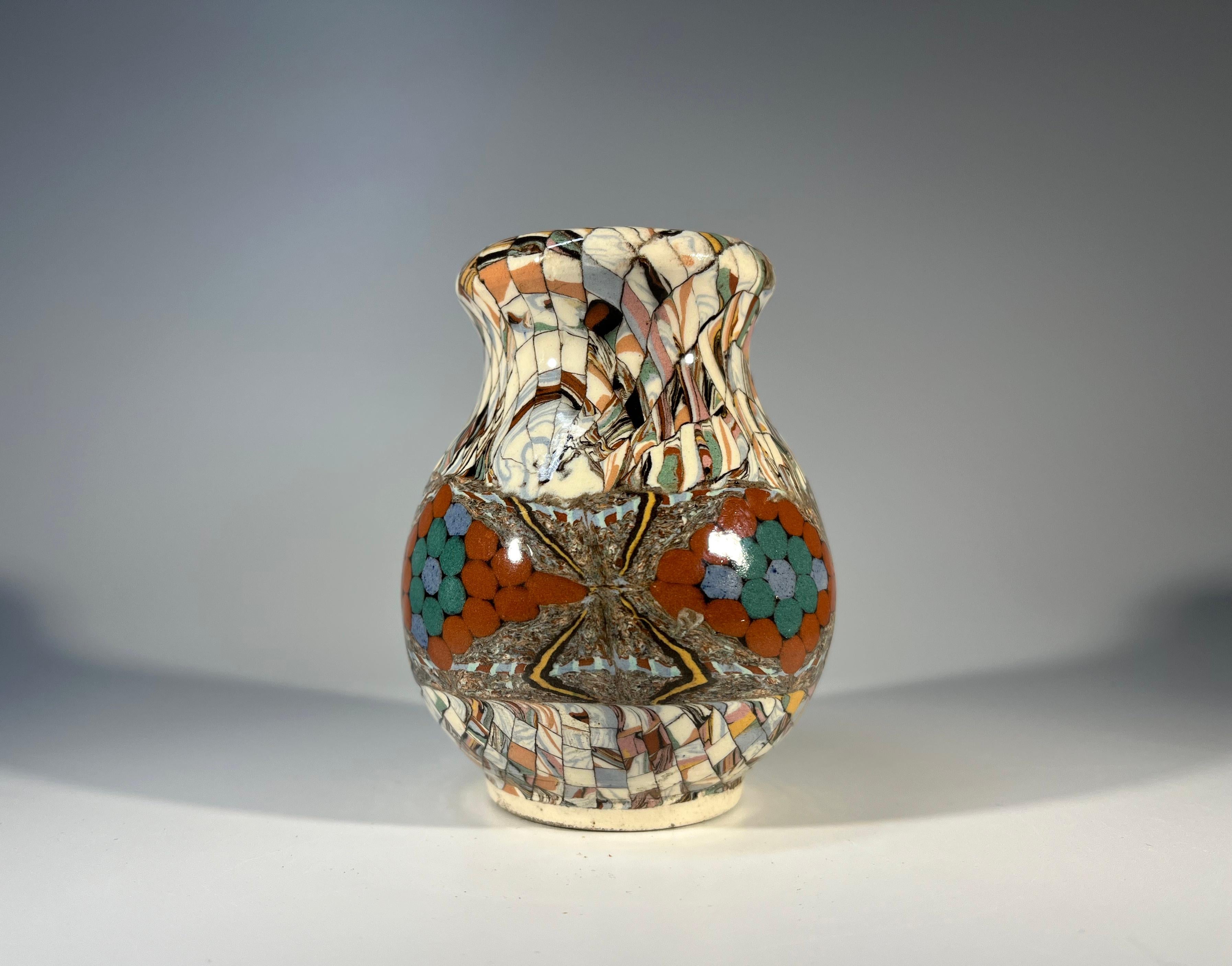Sweet and diminutive vase using the Neriage technique by Jean Gerbino for Vallauris, France
Ceramic glazed shaped vase, with mosaic patterning and terracotta accents
Circa 1960's
Signed Vallauris Gerbino to base
Height 3.5 inch, Diameter 2.75