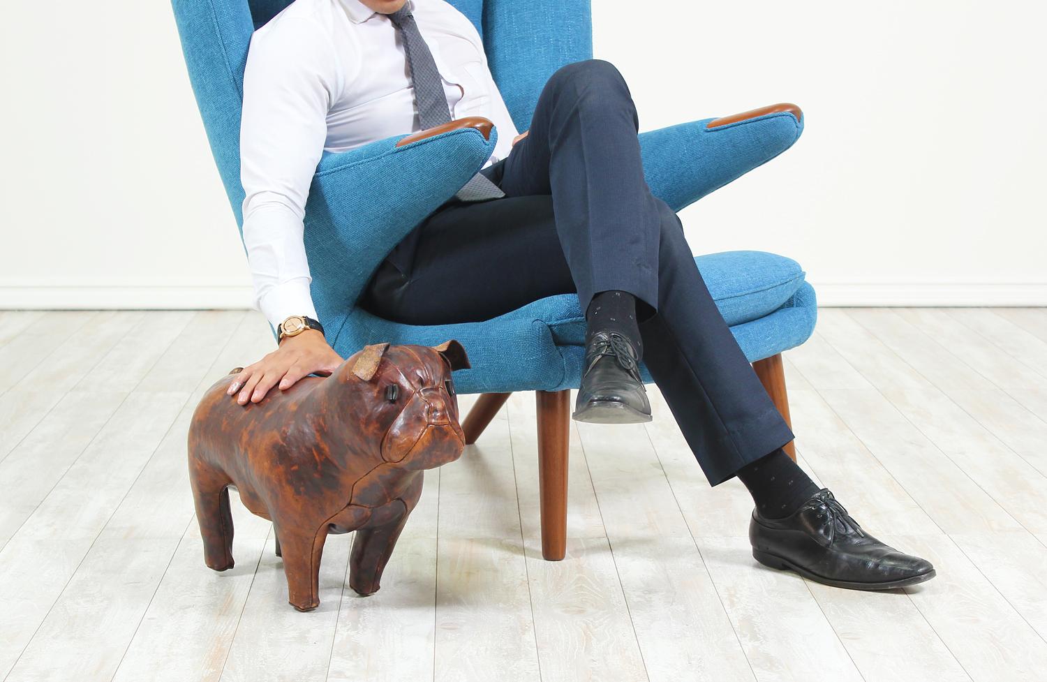 Adorable leather bulldog designed by Dimitri Omersa for Abercrombie and Fitch in England circa 1960’s. Originally designed to serve as a footstool, designer Dimitri Omersas’ sculptures are now collectors art. It features original hand-stitched