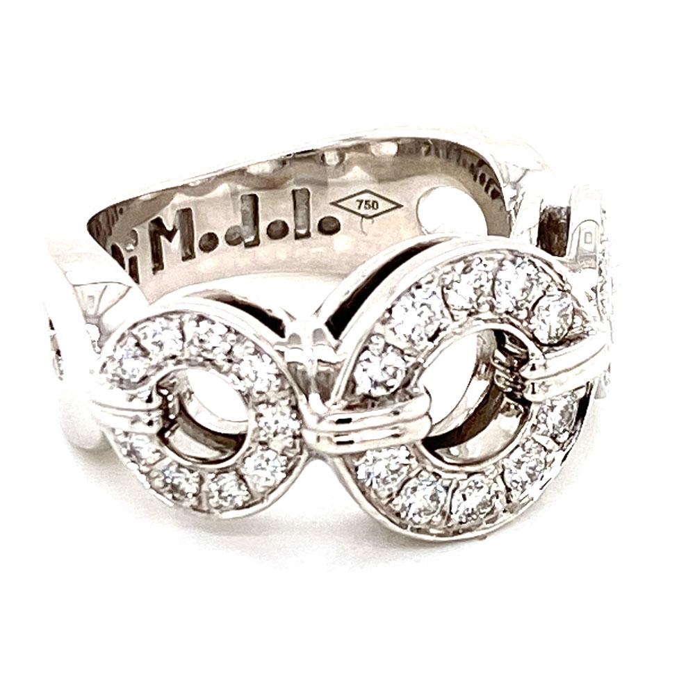 DiModolo Tempia Diamond Band Ring fashioned in 18 karat white gold. The diamond band features three round open circles encrusted with 28 colorless round brilliant cut diamonds (.57 carat total weight). The band is size 5.5, measures 11mm in width,