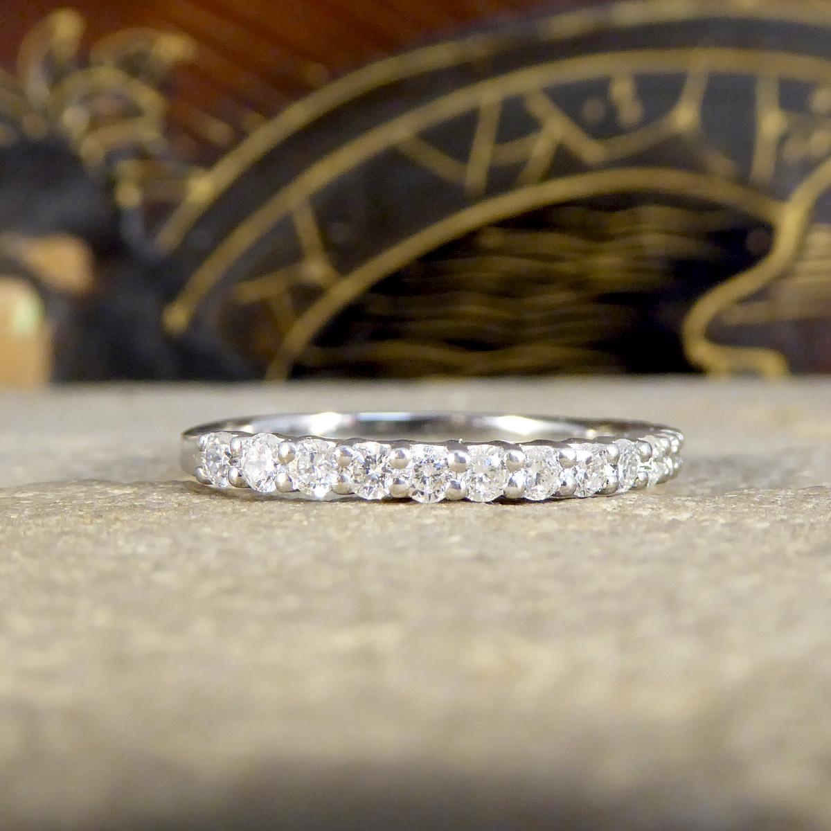 Elevate your jewellery collection with this Diamond set half eternity stackable ring, flawlessly crafted in premium platinum. Featuring a total diamond weight of 0.45ct, this ring shines with a row of meticulously set diamonds, offering a continuous