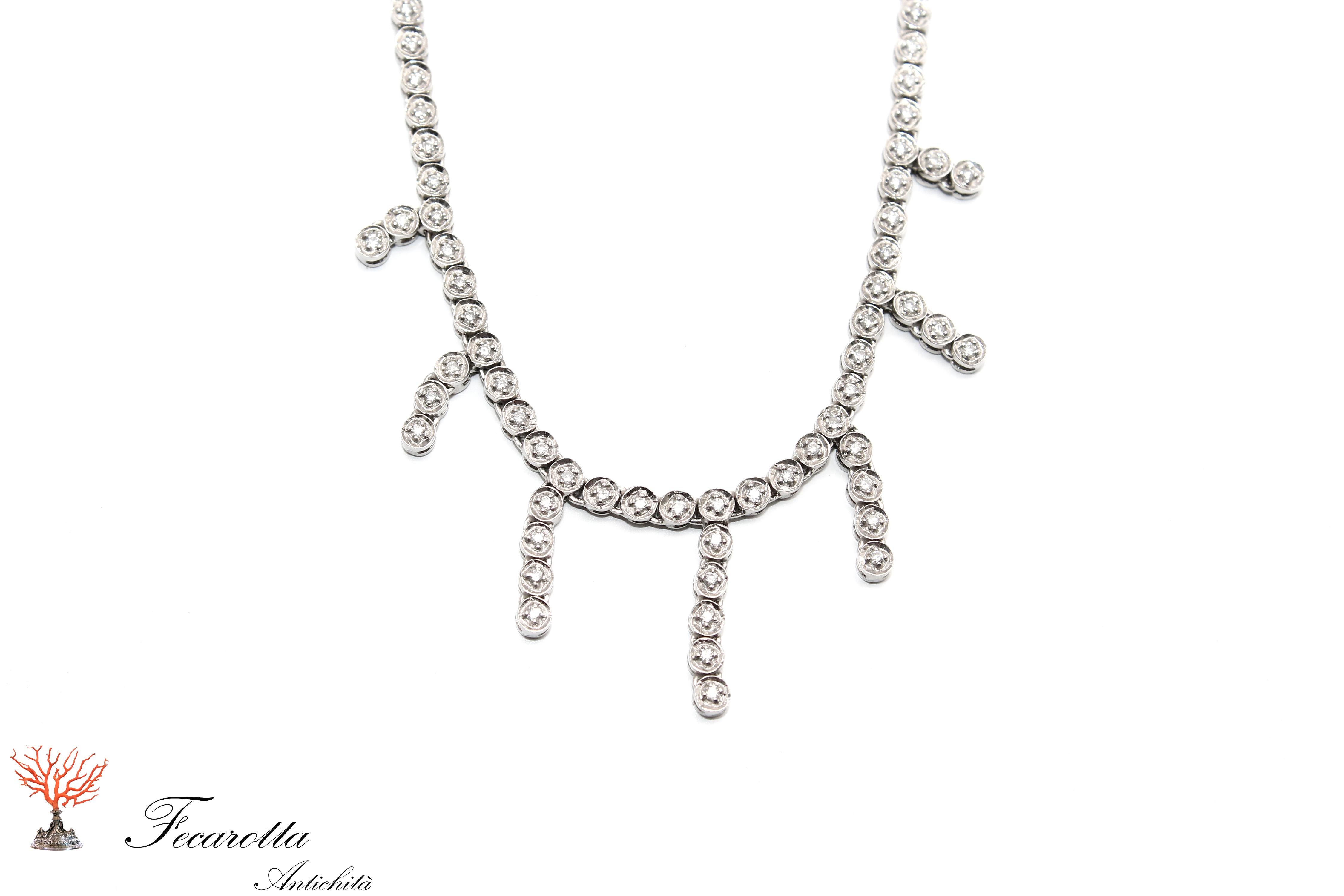18 kt white gold choker necklace with pendant.
 total 1.20 ct diamonds colour G-Vs1. Made in Italy

