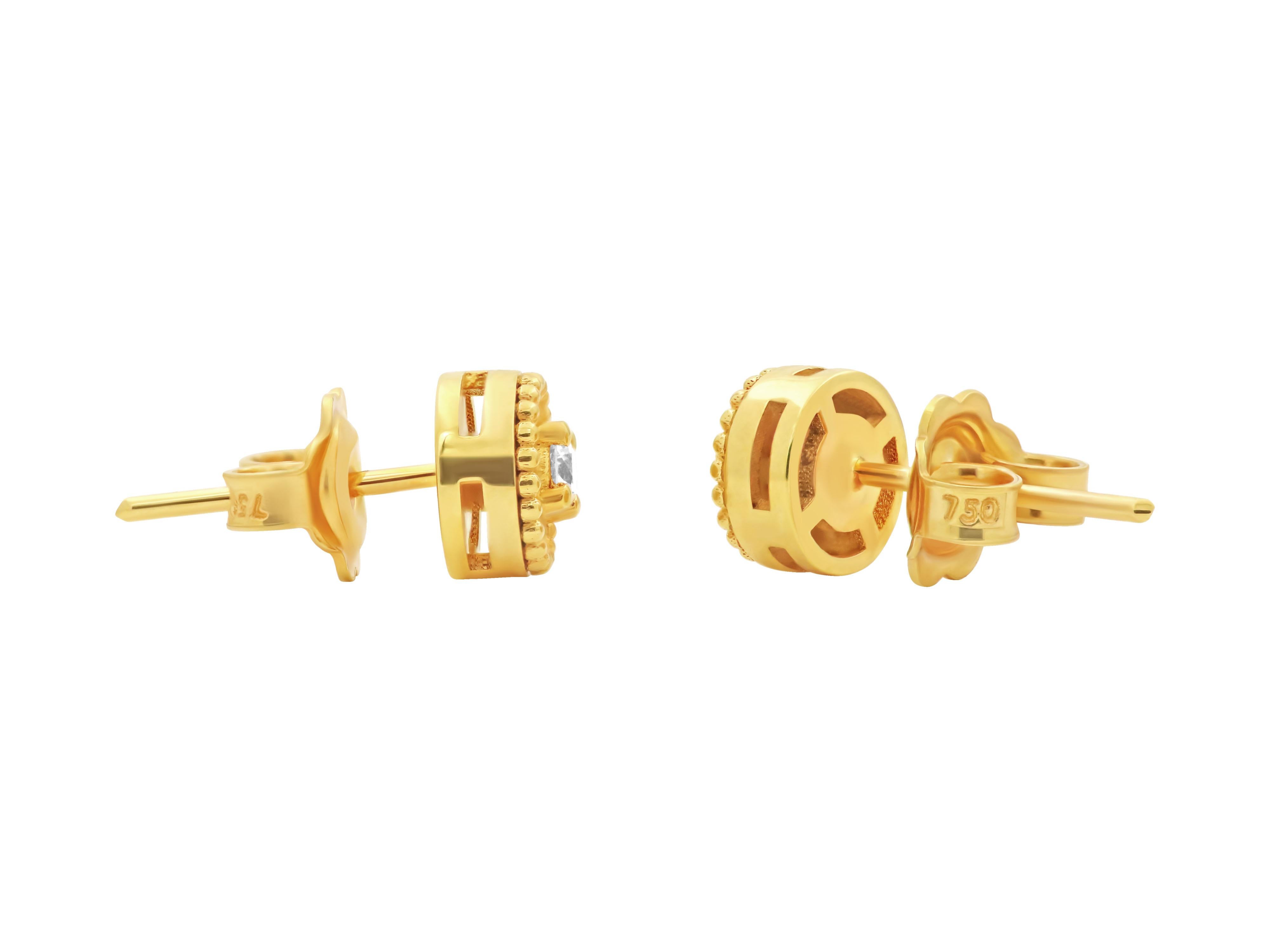 18k gold Balance earrings. The single balance stud that says is it all. Round elements of neo classic aesthetics with granulation and set with very white brilliant diamonds to assure that even small can be powerful. The perfect daily 24/7 earrings.
