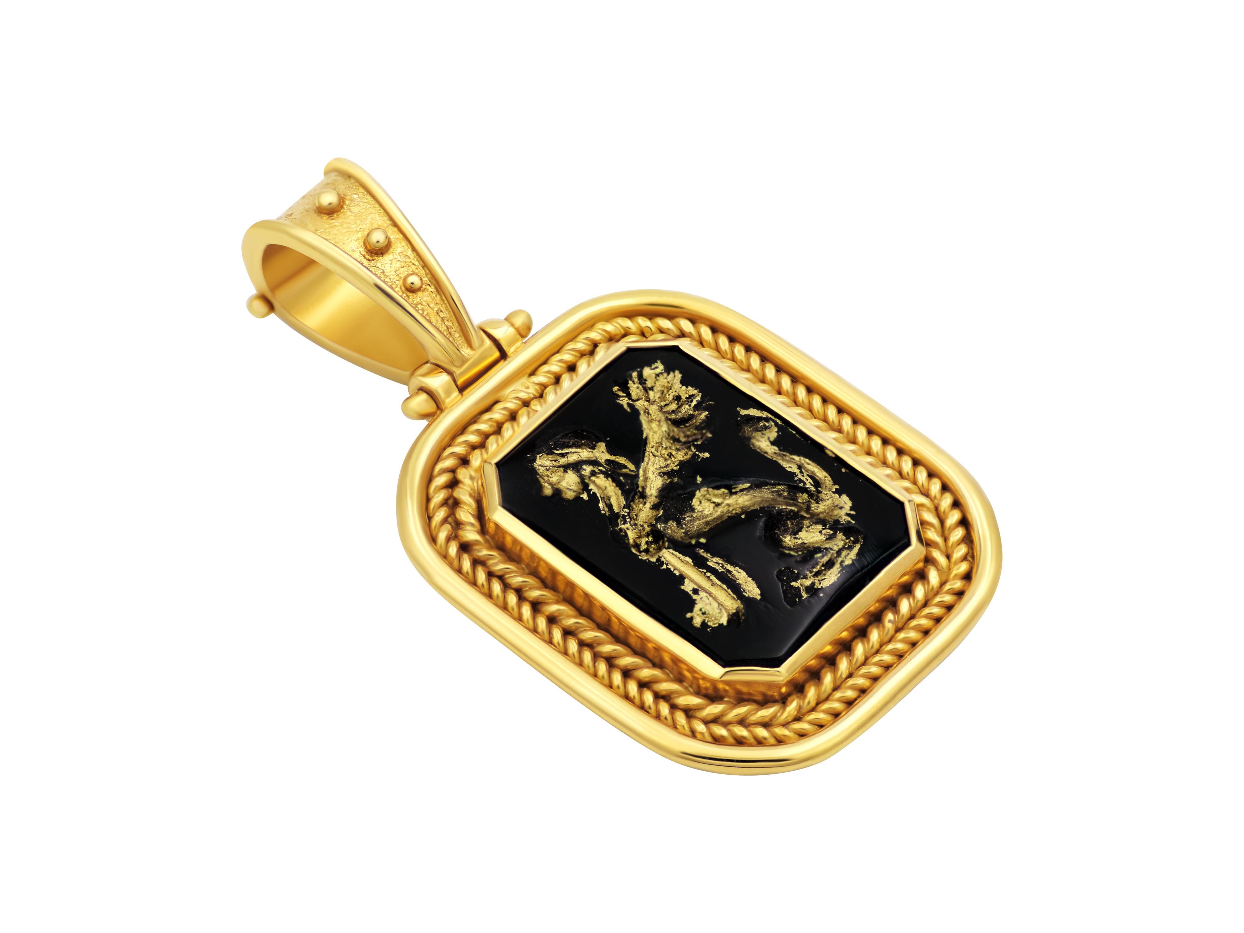Museum replica pendant in 18 karat yellow gold completely handmade set with black Onyx hand carved with the mythical sphinx. A beautiful and regal setting with double wires and filigrees complete this elegant pendant. Here we have used gold paint to