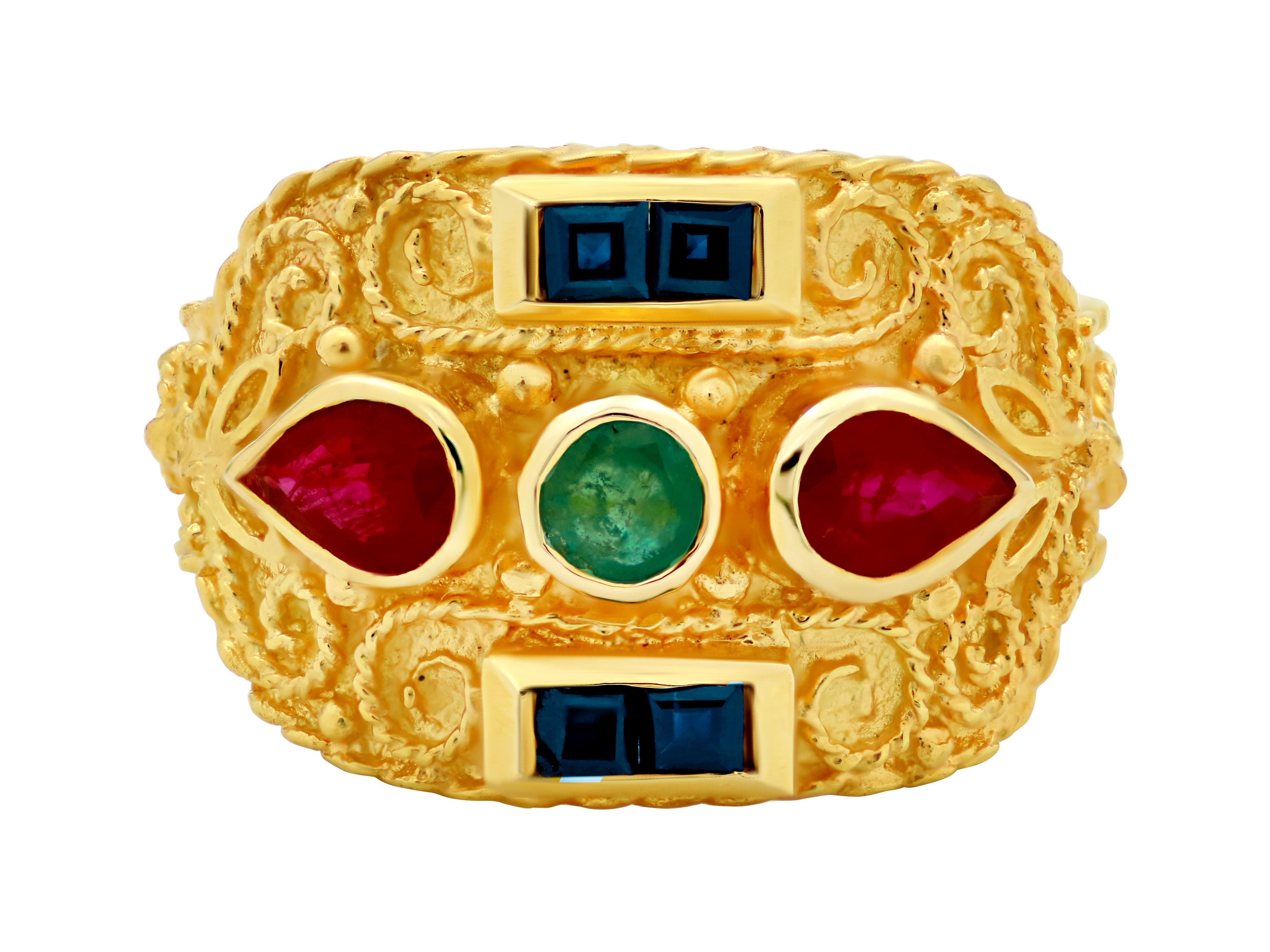 Byzantine ring in 18 karat yellow gold with a dynamic width and a narrow band to give comfort. A variety of 0.60 carats natural gems giving the authentic multicolor look of the Byzantine era. Artwork with filigrees and granulation complete this ring.