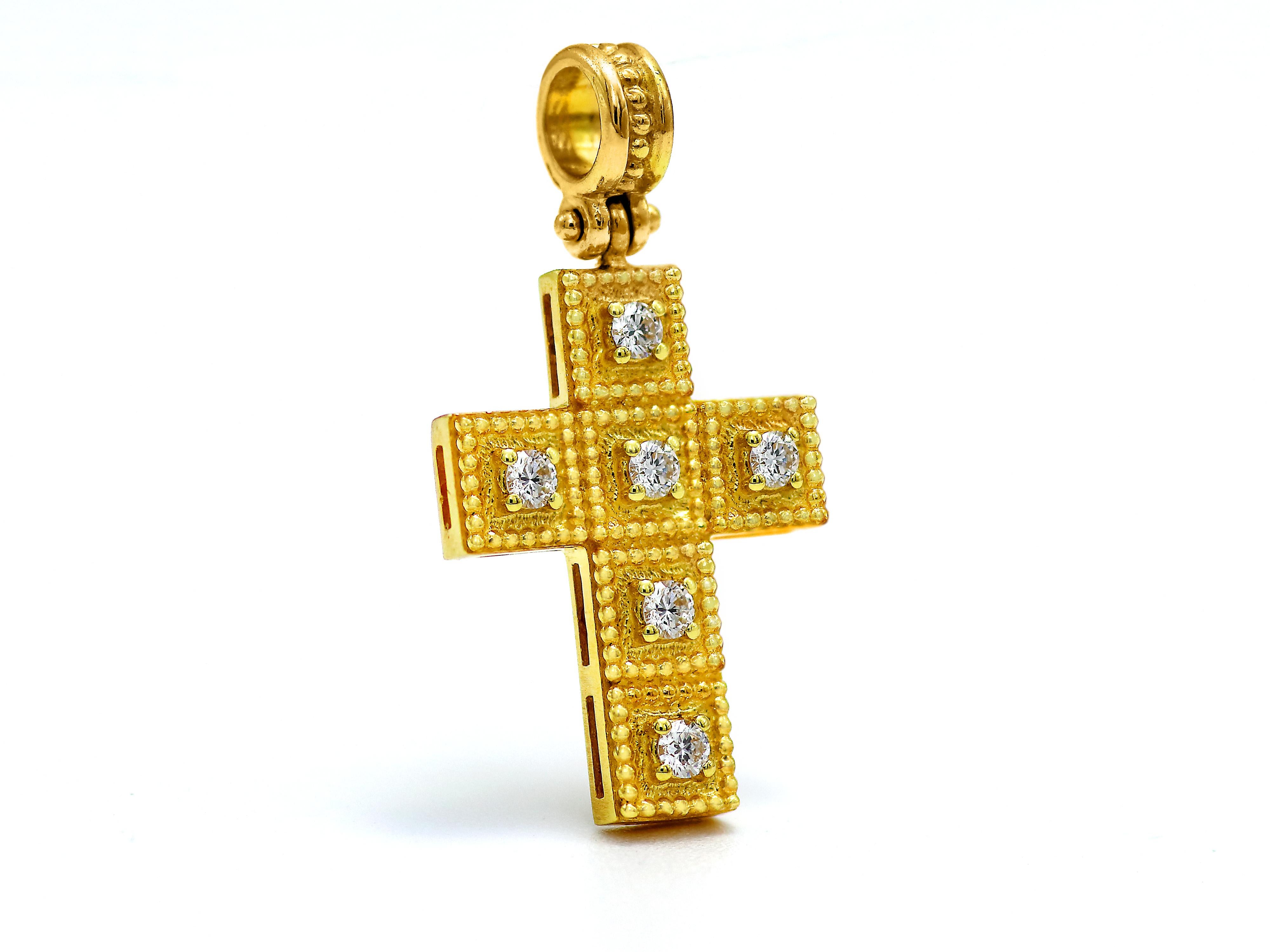 18k gold cross with neoclassical inspiration work of granulations and a beautiful setting of six 0.24 carats brilliant cut diamonds. Every tasteful piece of the balance collection with a strong thick bezel that will make you wear it carefree. On the