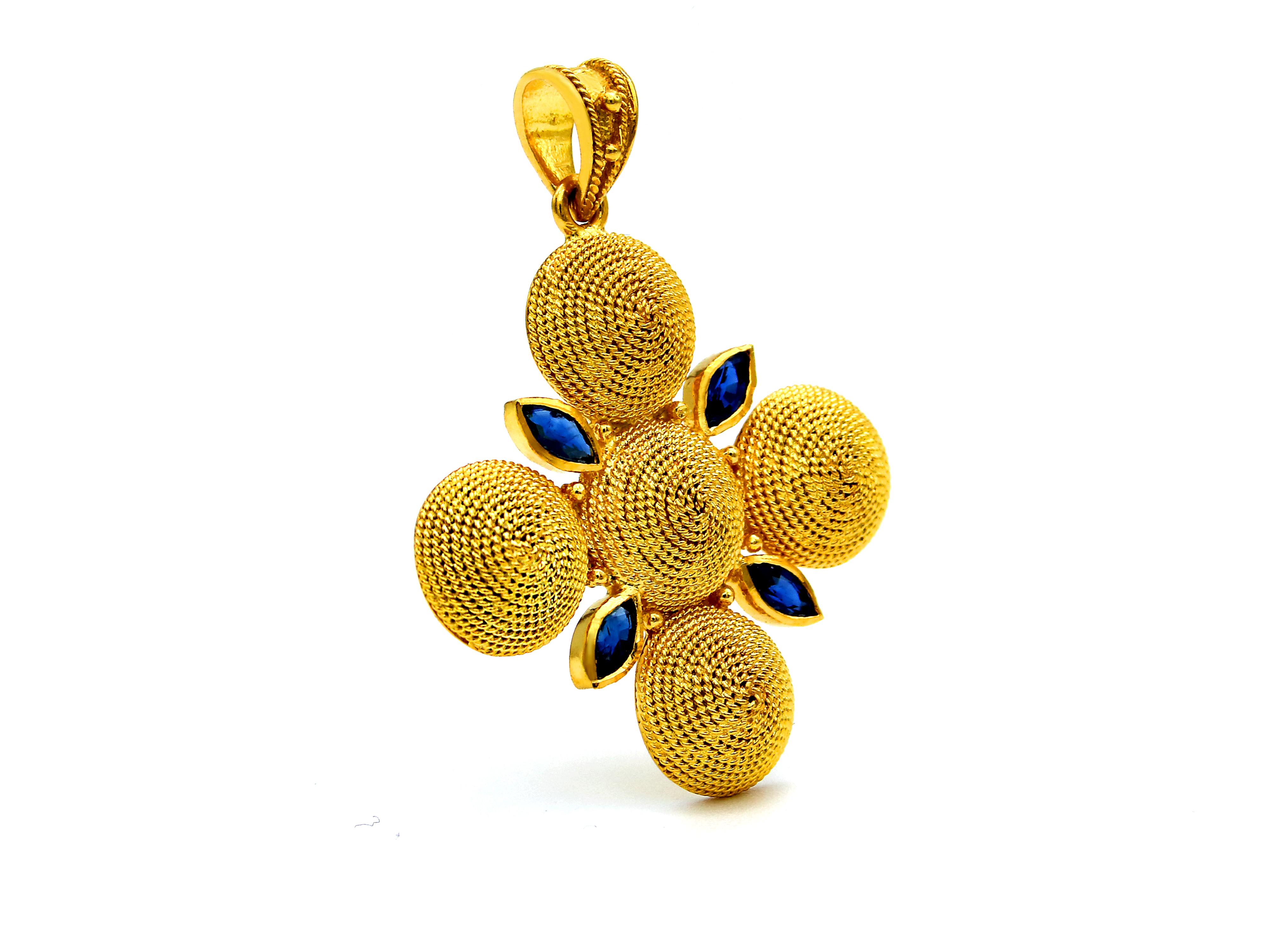 Filigree cross pendant in 18k gold with 0.70 carats sapphires. The smoothness and the peacefulness of the particular filigree work sets it to the most suave feeling that these filigrees create. Peaceful, quiet and precision it’s the motions that I