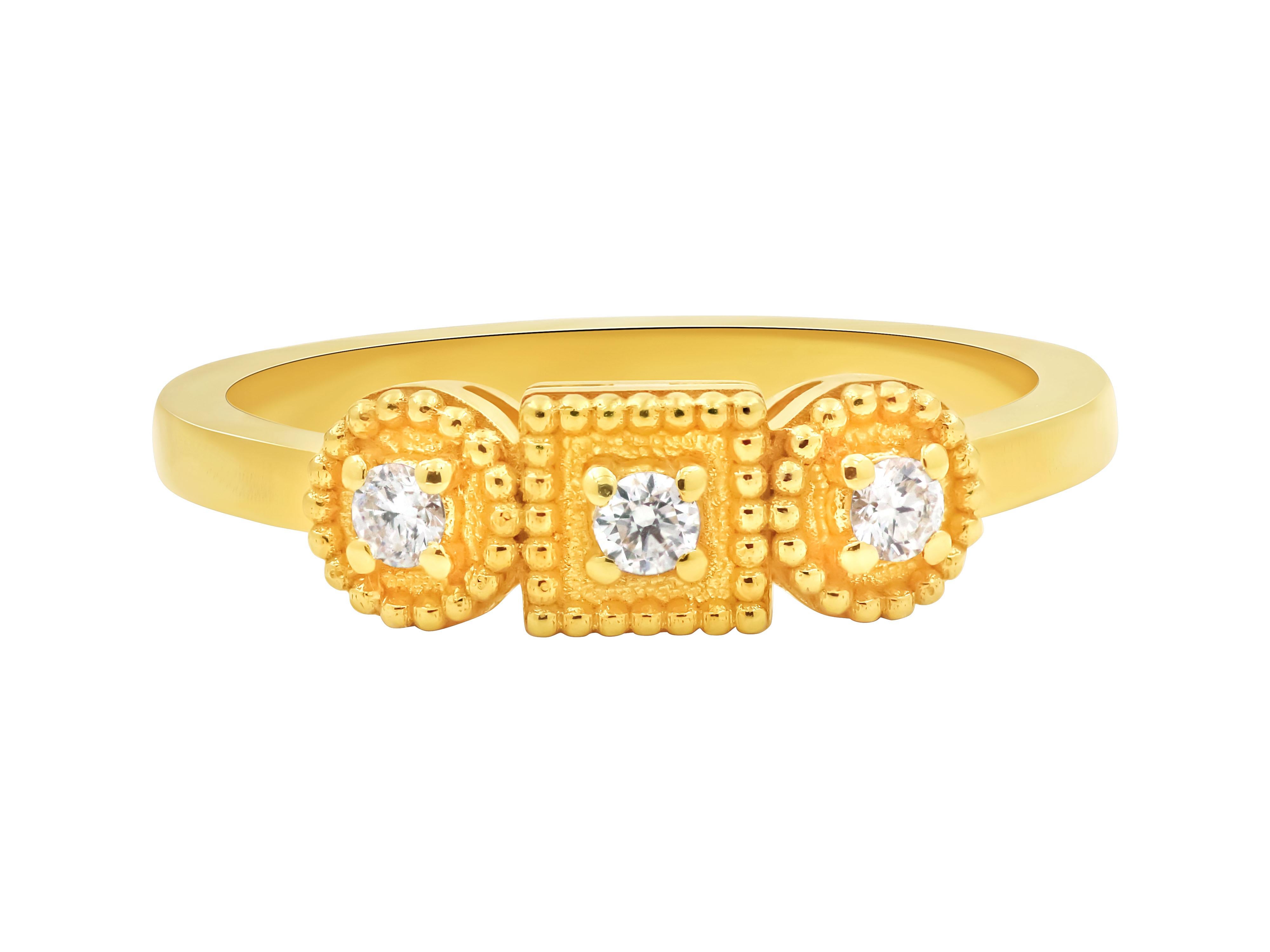 Greek granulated neoclassic ring in 18k gold with three brilliant cut diamonds total 0.12 carats that combines classical aesthetics with modern techniques. The neoclassic design of the ring takes inspiration from Ancient Greek art, characterized by
