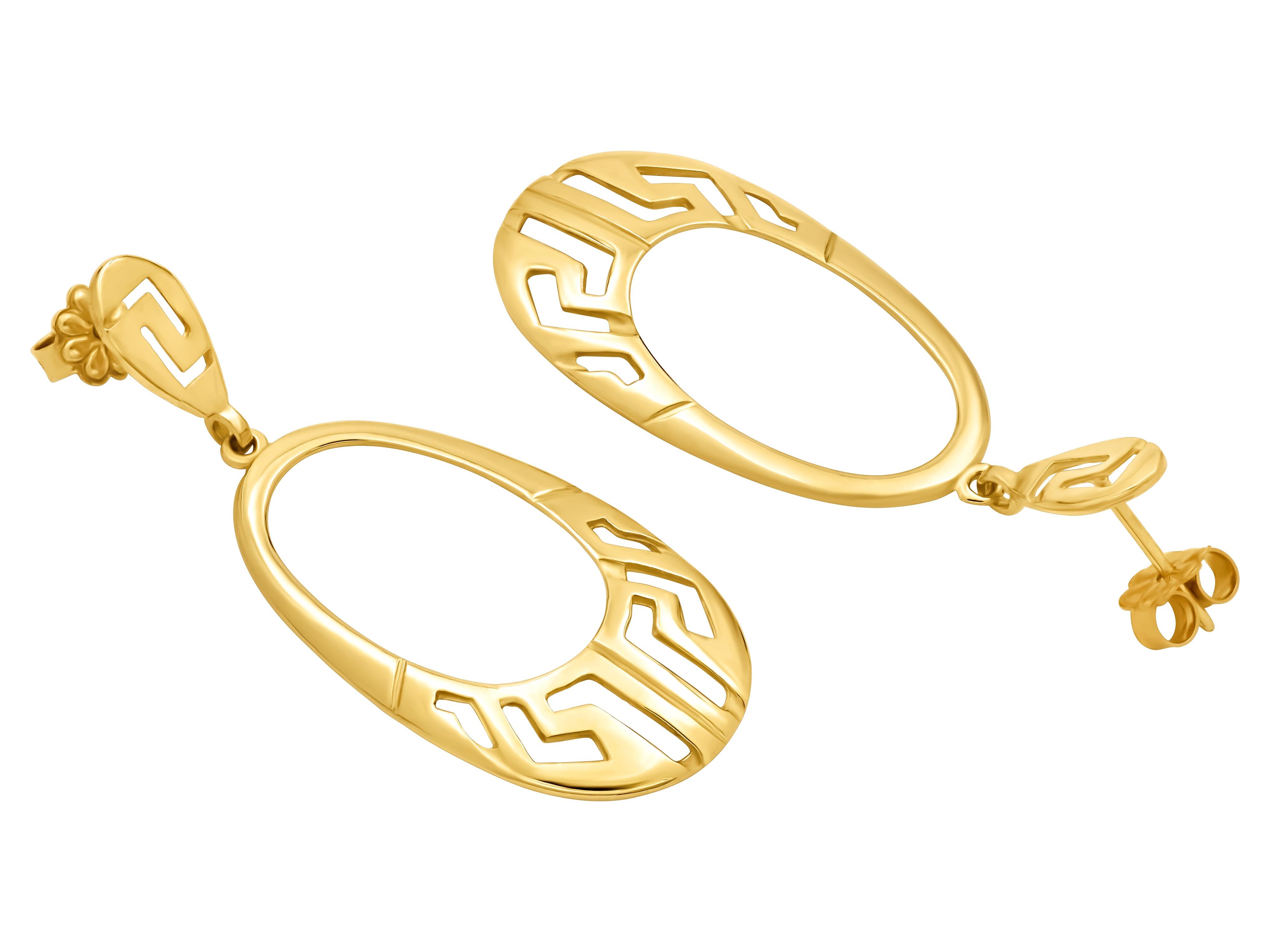 Greek key oval earrings in 18k yellow gold. Unique and not commercial piece with depth and character. A not small size but very light in the eyes due to its openness. Can be made to order in white gold or set with a diamond pave finish. You will