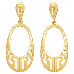 Boucles d'oreilles ovales Dimos en or 18k avec clé grecque