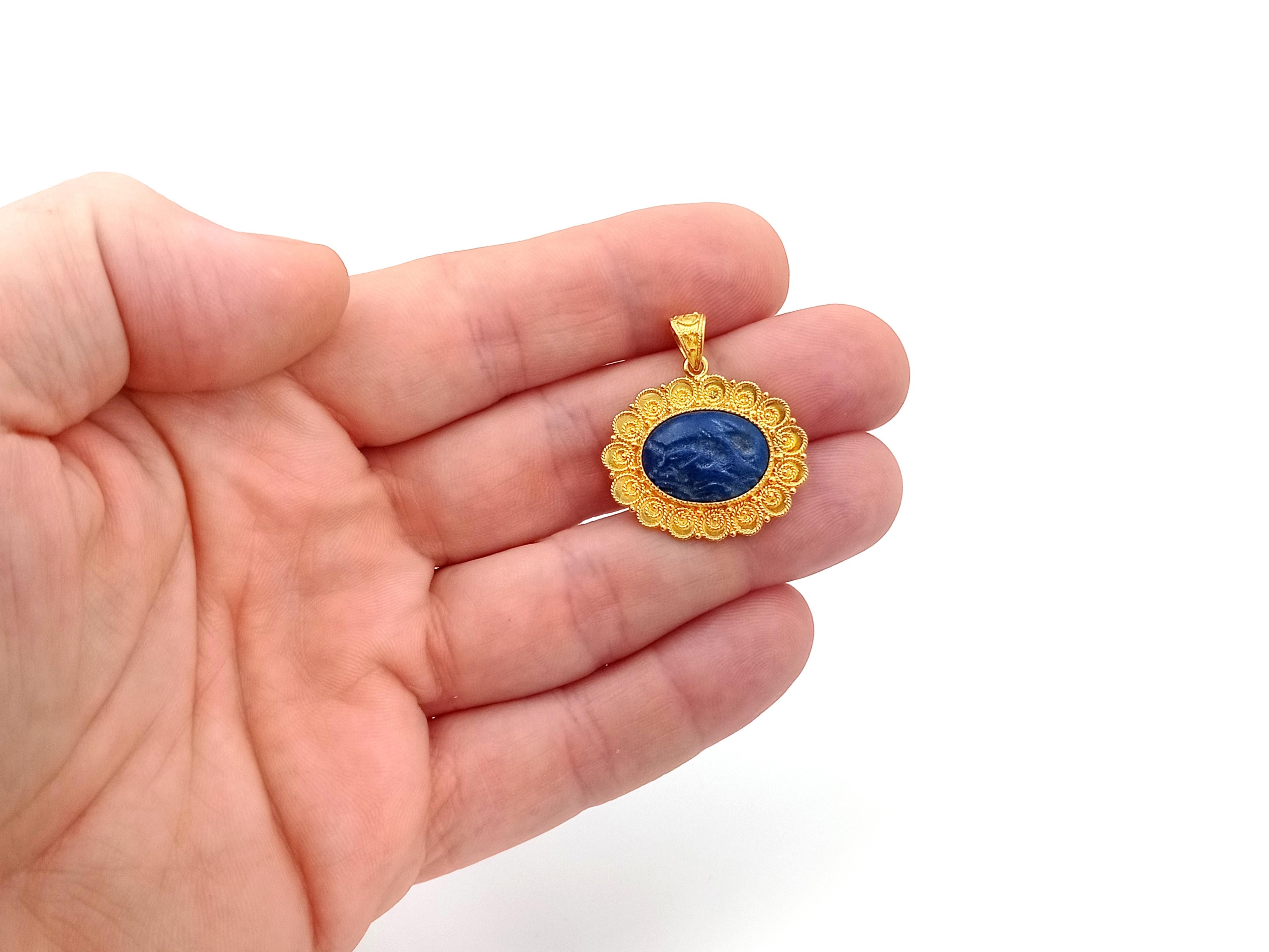 carved lapis lazuli pendant