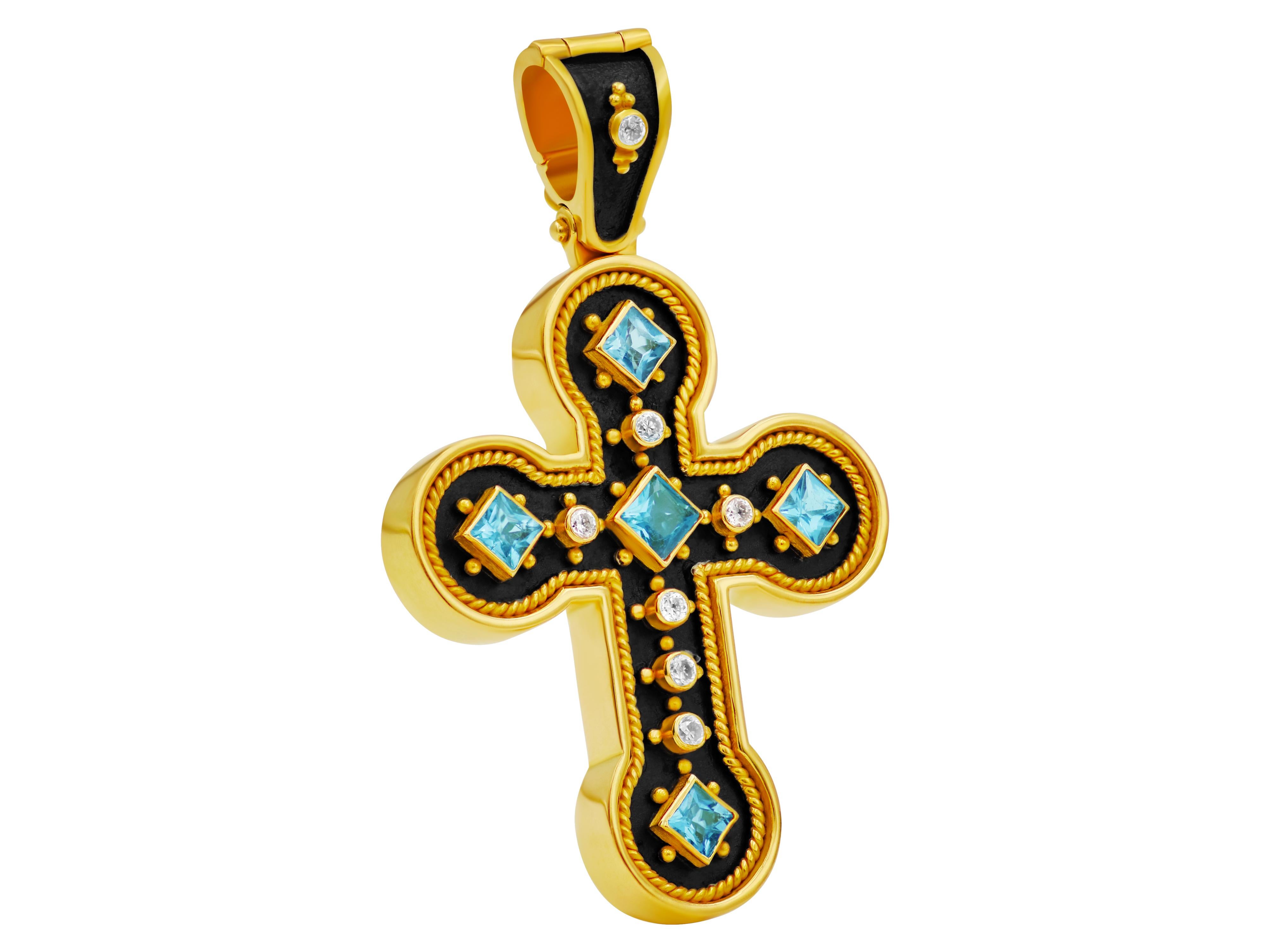 18k yellow gold cross from the Noir collection and this one apart of the seven 0.14 carats very white diamonds it set with five 0.65 carats princess cuts aquamarines. Filigrees and granulation show the high level of work. Make sure you see the back