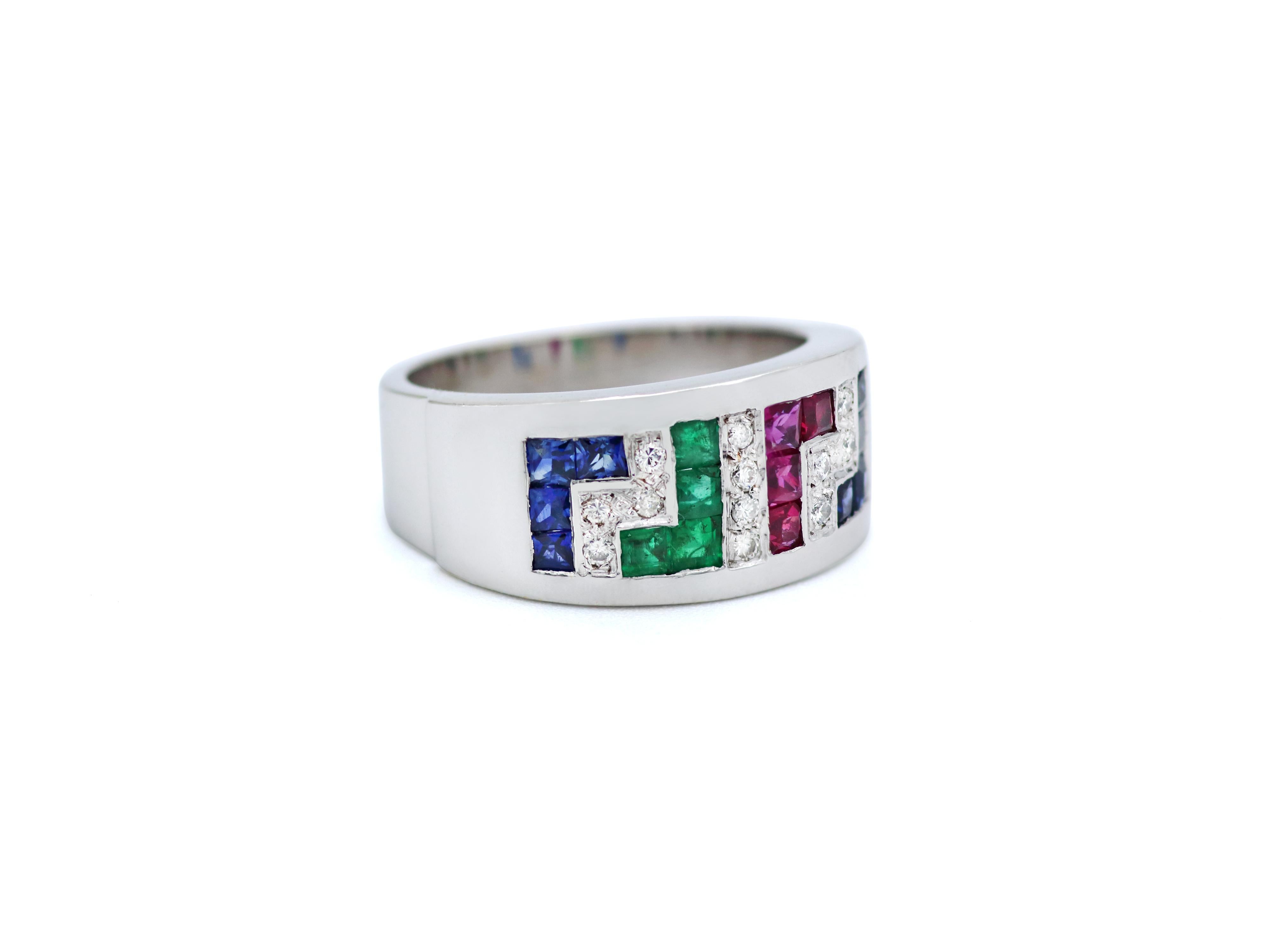 Band ring in 18 karats white gold set with colorful gems, 1 carat of Rubies, Emeralds, Sapphires and 0.15 carats of natural brilliant cut diamonds that adds light and luxury to the piece. 

DIMENSIONS
Band top width: 0.354