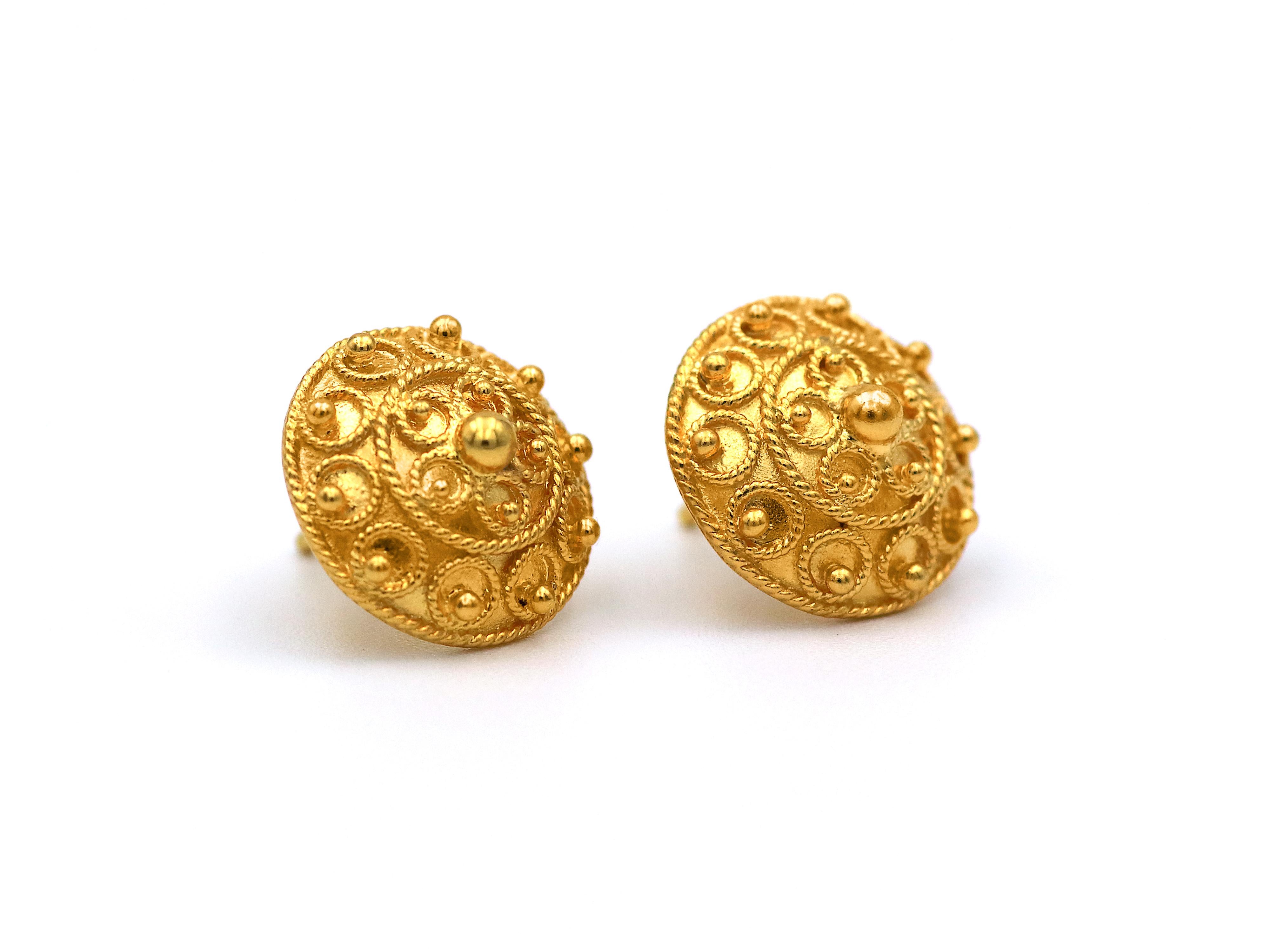 Bocola stud earrings set in 22k yellow gold. The design is created with circles of filigree and topped with granulations of different size all around.  All solid and could be worn daily without worrying.