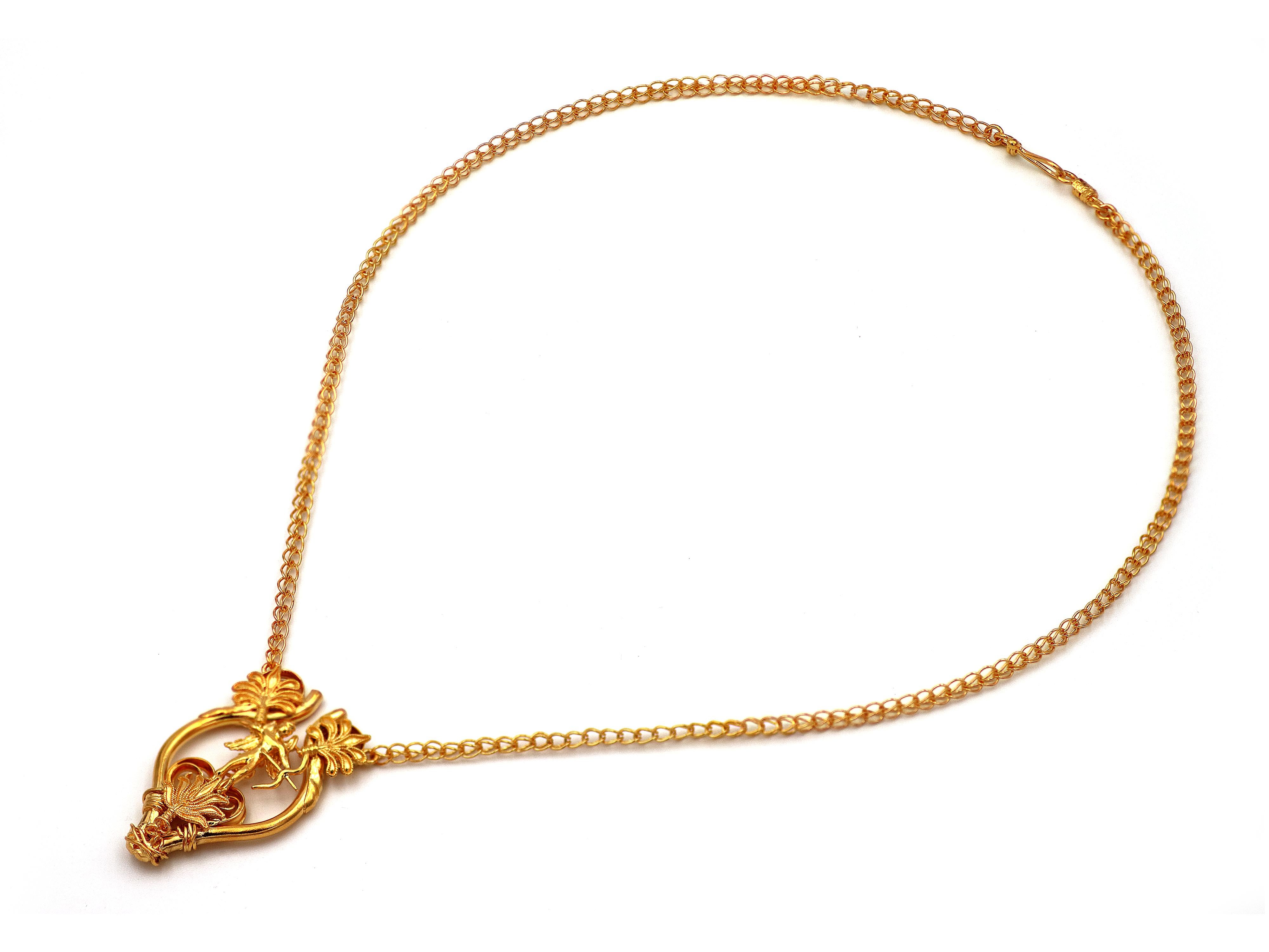 22k gold Daily God of Love (EROS). The daily version of our flagship creation in a small wear with the sculpting statue of Aris in the center the acanthus leaves in the filigrees escorting it. The chain completely looped by loop handmade in 18k gold