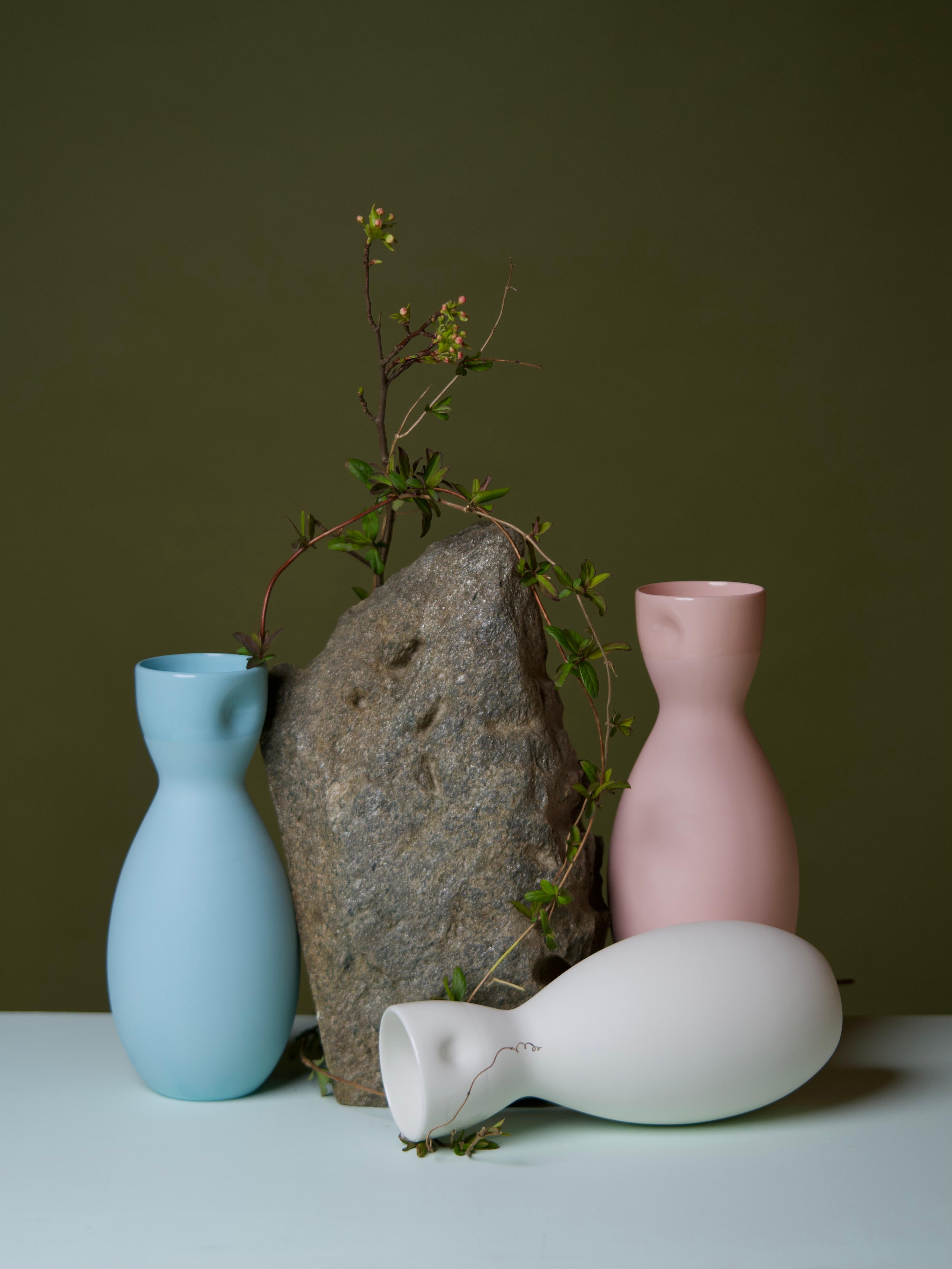 Middle Kingdom dimpled porcelain carafes are designed by Carola Zee of Rotterdam, Holland. Each carafe is molded and then dimpled by the hand of the potter to create a unique and comfortable hold. There are three colors available, and corresponding