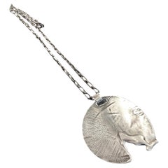 Dina González Mascaró "melted medal" pendant necklace oxidized sterling silver